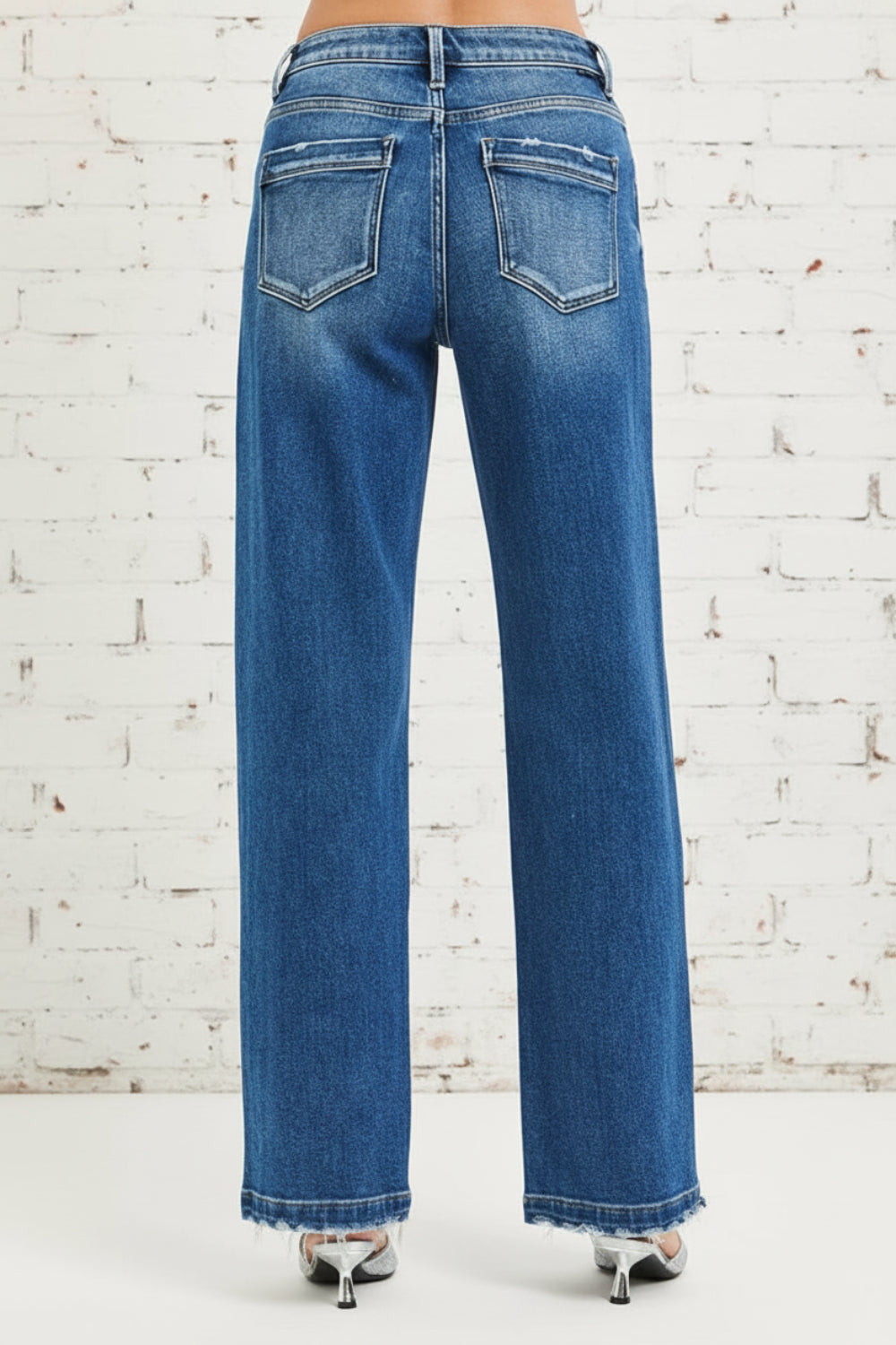 Risen Jeans, full-size, mid-rise, side seam detail, raw hem, slouchy, baggy, belt loops, pocketed, button/zipper closure, slightly stretchy, back view
