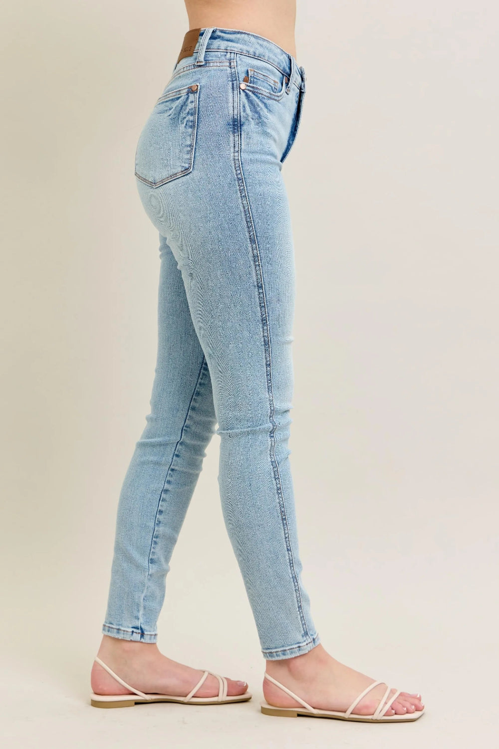 Judy Blue Jeans, full-size, mid-rise, 5-pocket design, light wash, button-zip closure, ankle length, slightly stretchy, side view