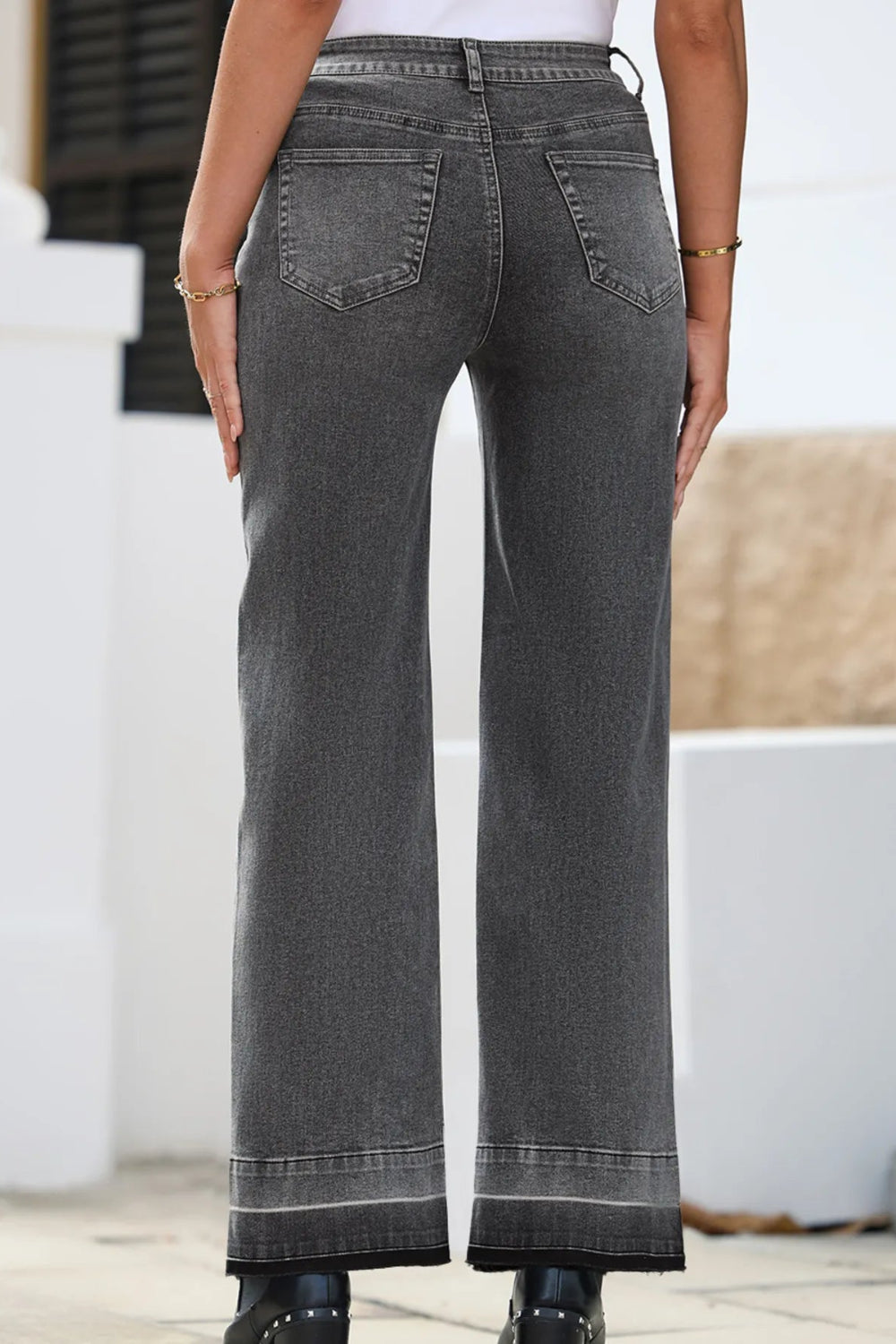 Jeans, high-rise, drop hem, raw hem, straight leg, pocketed, belt loops, button/zipper closure, vintage wash, some stretch, back view