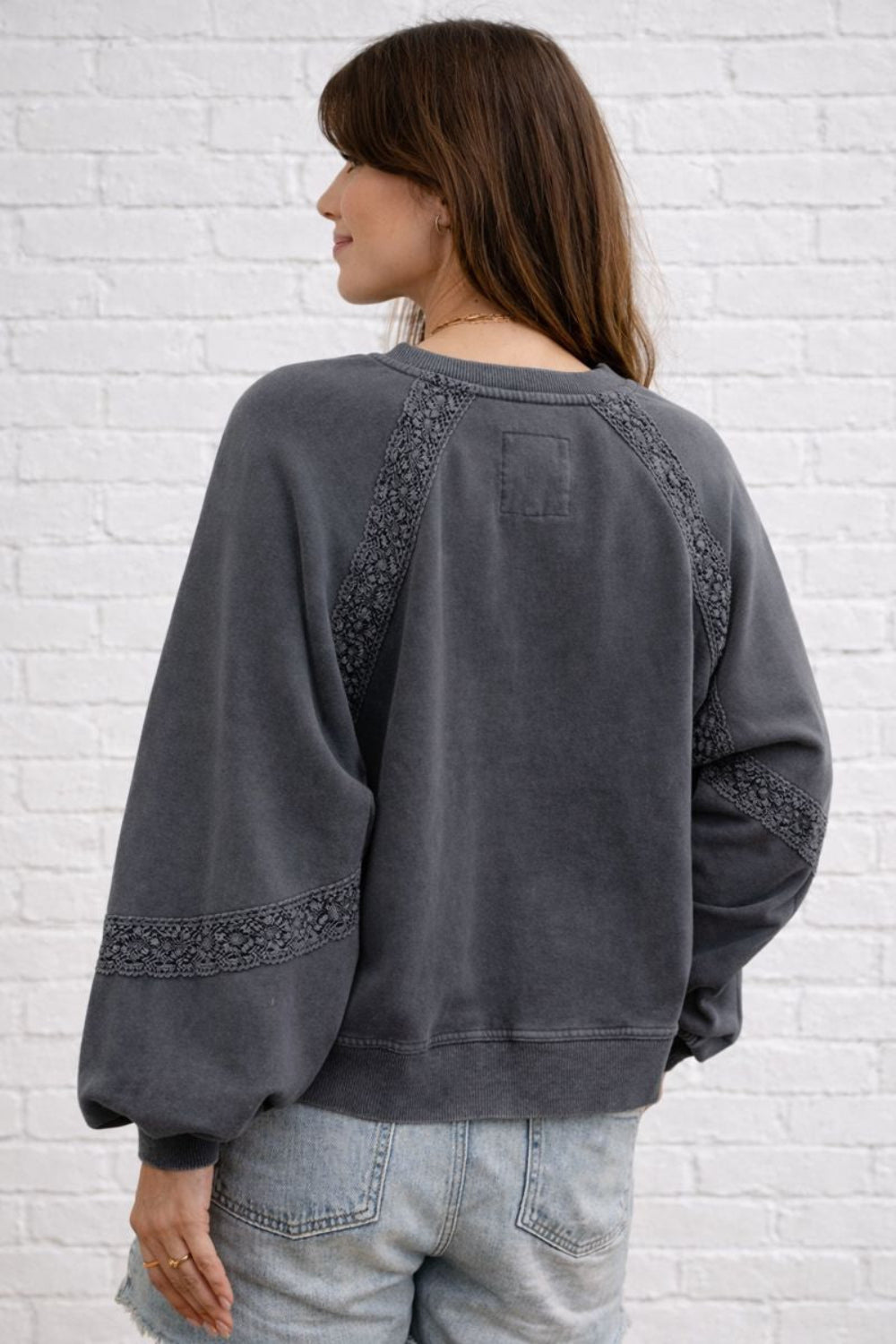 sweatshirt, washed, pullover, long sleeve, notched neck, raglan style, lace detail, oversized, slightly stretchy, back view