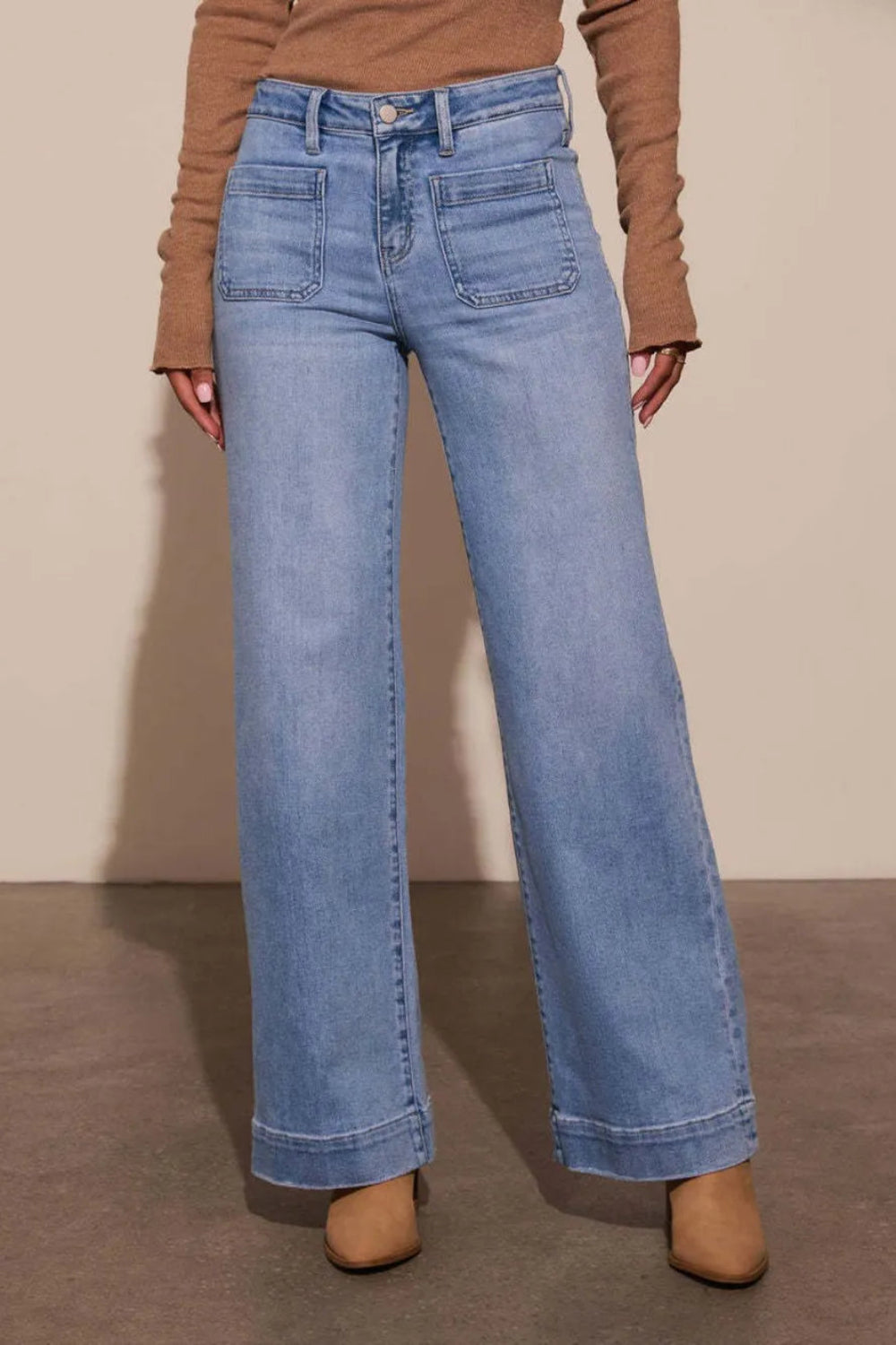 Jeans, high-waist, vintage wash, wide leg, front patch pockets, raw hem, back pockets, wide cuff, vintage wash, button/zipper closure, belt loops, slightly stretchy, front view