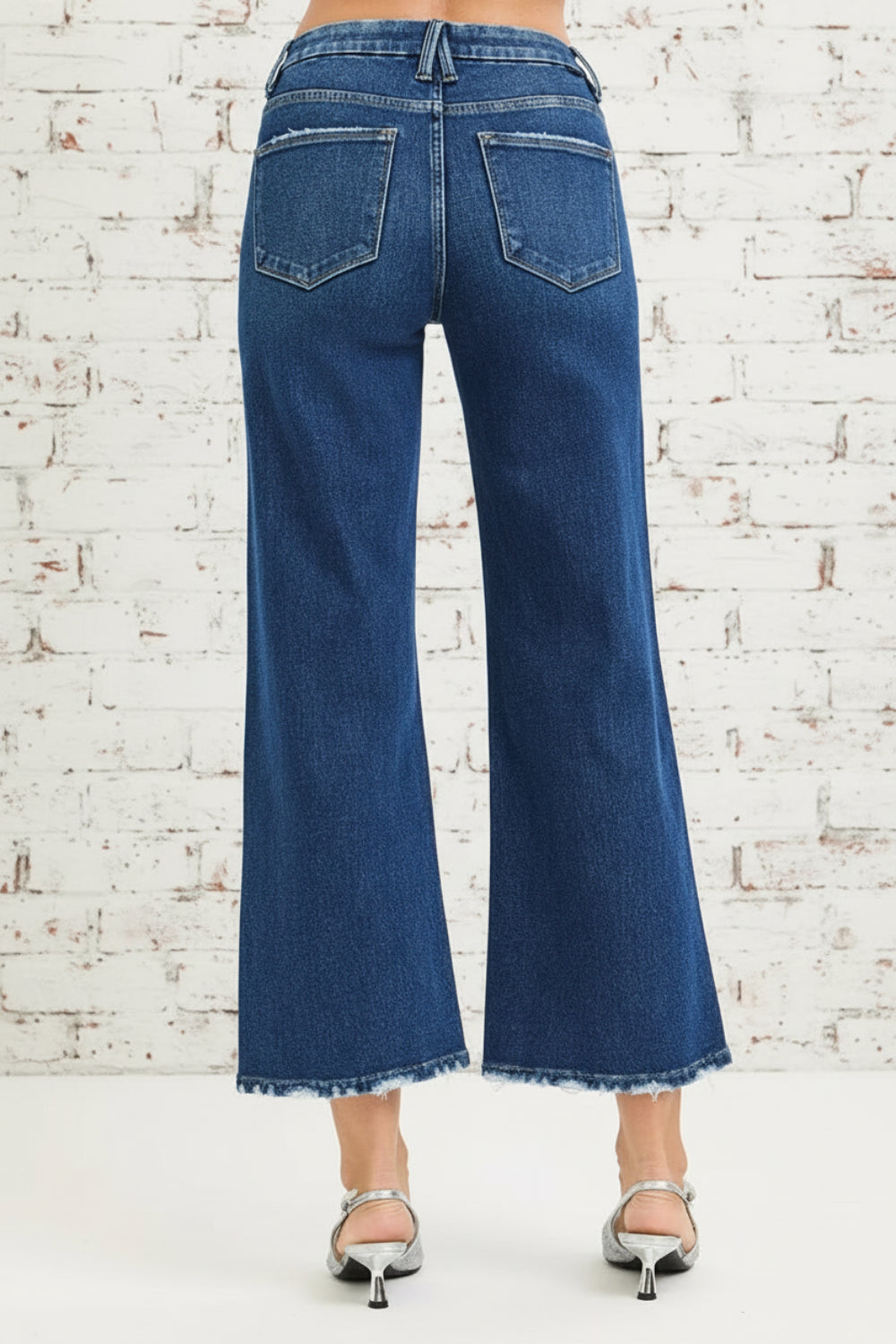 Risen Jeans, high-rise, tummy control, 4-way stretch, cropped, raw hem, wide leg, belt loops, pocketed, button/zipper closure, dark wash, slightly stretchy, back view