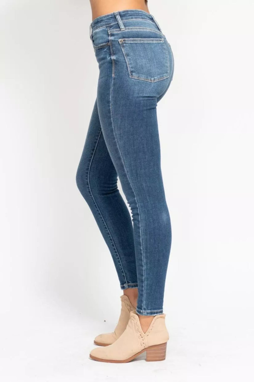 Judy Blue Jeans, full-size, high-rise, button fly, pocketed, belt loops, skinny leg, medium wash, slightly stretchy, side view
