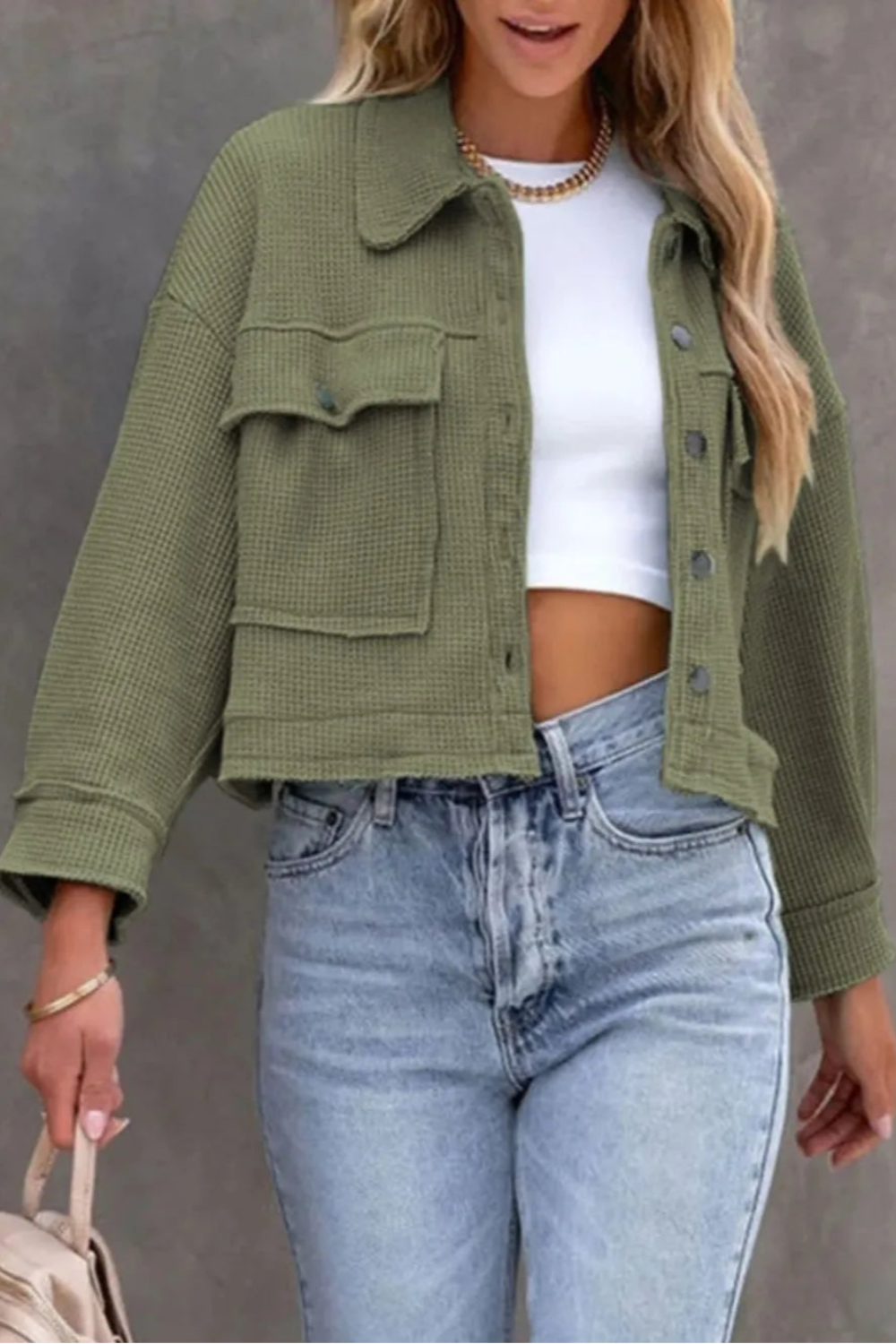 Jacket, collared, oversized, distressed, pleated, drop shoulder, buttoned, pocketed, long sleeve, waffle-knit, exposed seam, sits at the waist, pleated, adjustable straps, some stretch front view