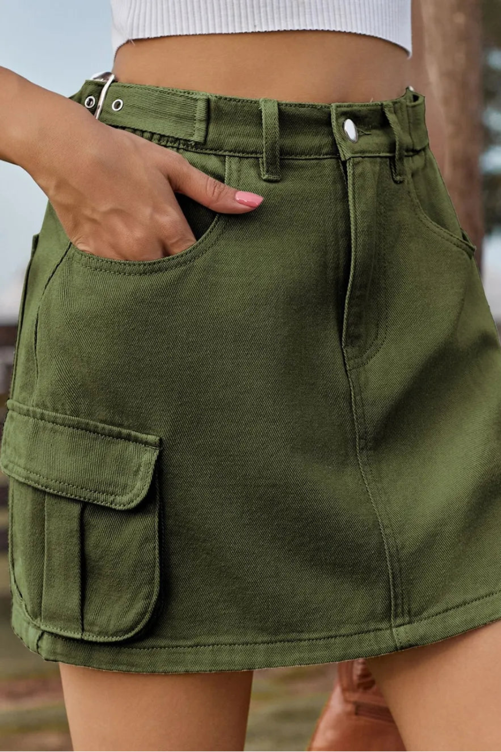 Adjustable Waist Denim Mini Skirt with cargo & patch pockets, elastic waist, and classic button-zip closure for a perfect, comfy, on-trend fit. front view