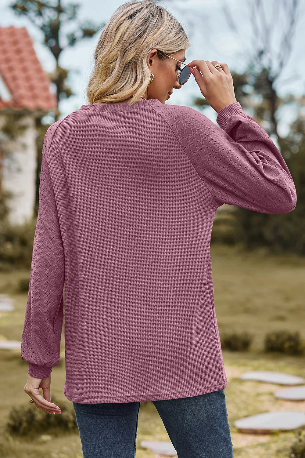 Top, raglan style, round neck, long sleeve, eyelet sleeves, ribbed, opaque, slightly stretchy, back view