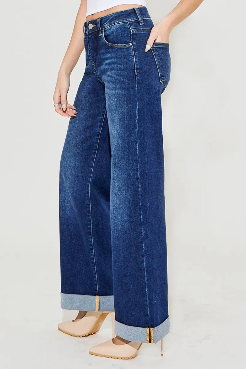 Risen Jeans, full-size, high-rise, denim, tummy control, wide leg, vintage dark wash, versatile roll up cuffs, 5-pocket construction, button/zip closure, belt loop waistband, slightly stretchy, side view