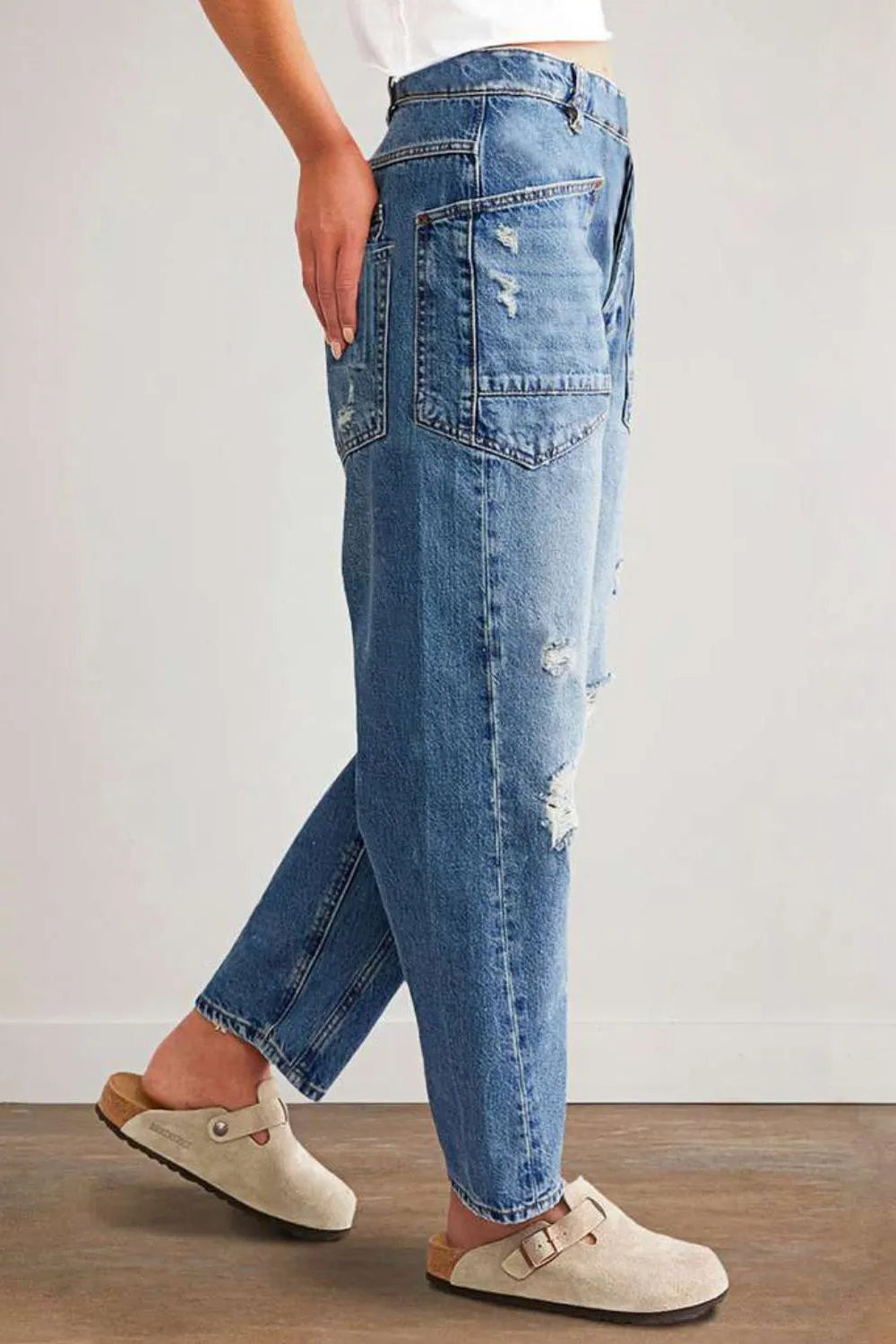 Jeans, high-waist, medium vintage wash, relaxed fit, shirred, distressed, pocketed, button/zipper closure, belt loops, front patch pockets, slightly stretchy, side view