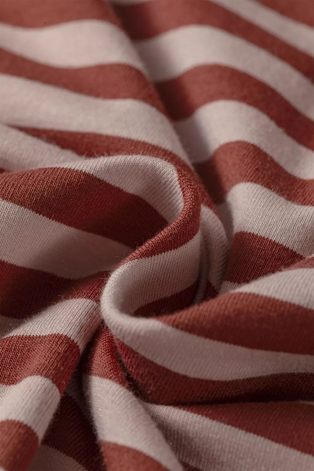 Say No More Short Set in cream and rust stripes with a long-sleeve drop-shoulder top and elastic-waist shorts, shown from a close up view.