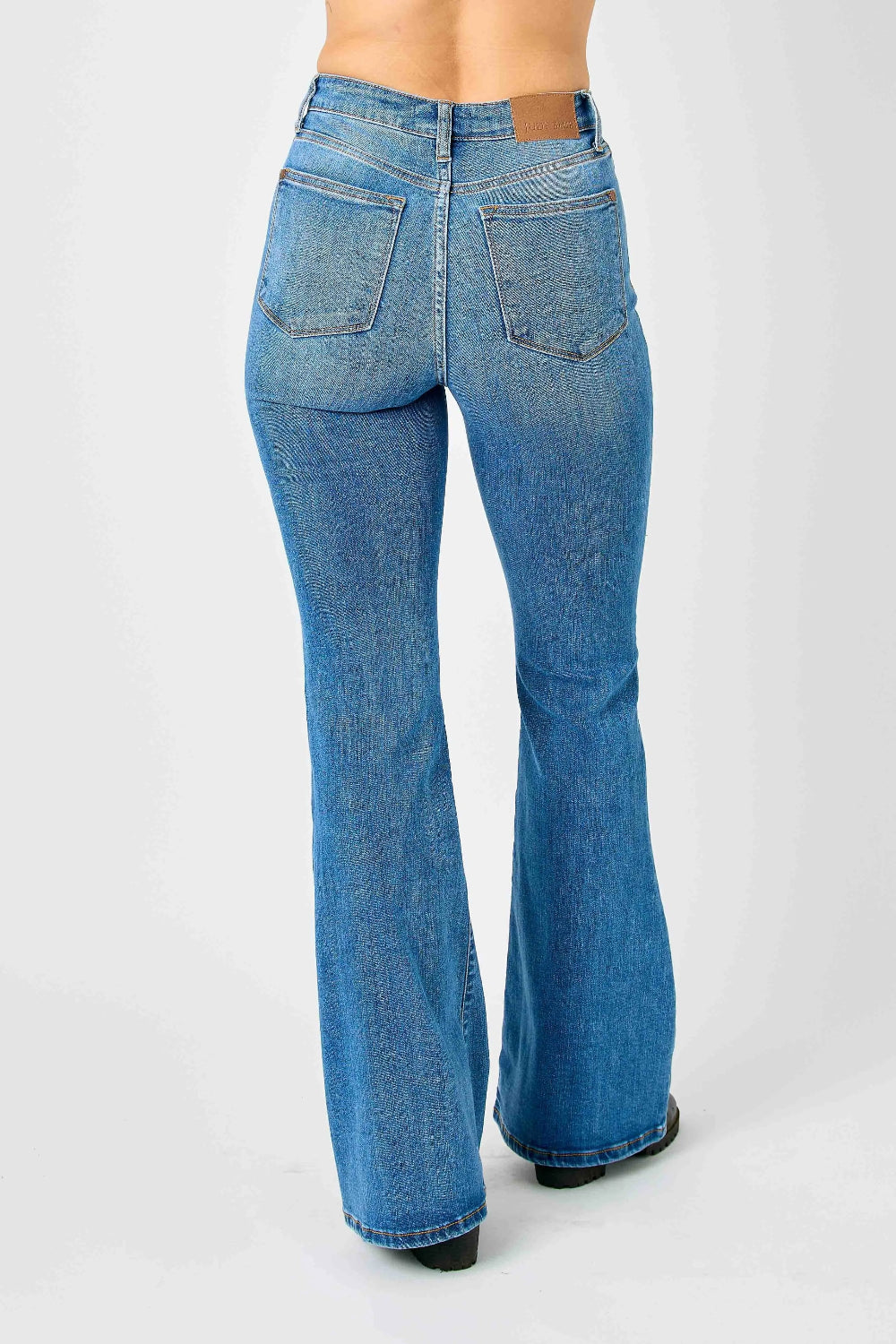 Judy Blue Jeans, full-size, high-rise, flared, pocketed, button and zipper closure, medium wash, slightly stretchy back view 
