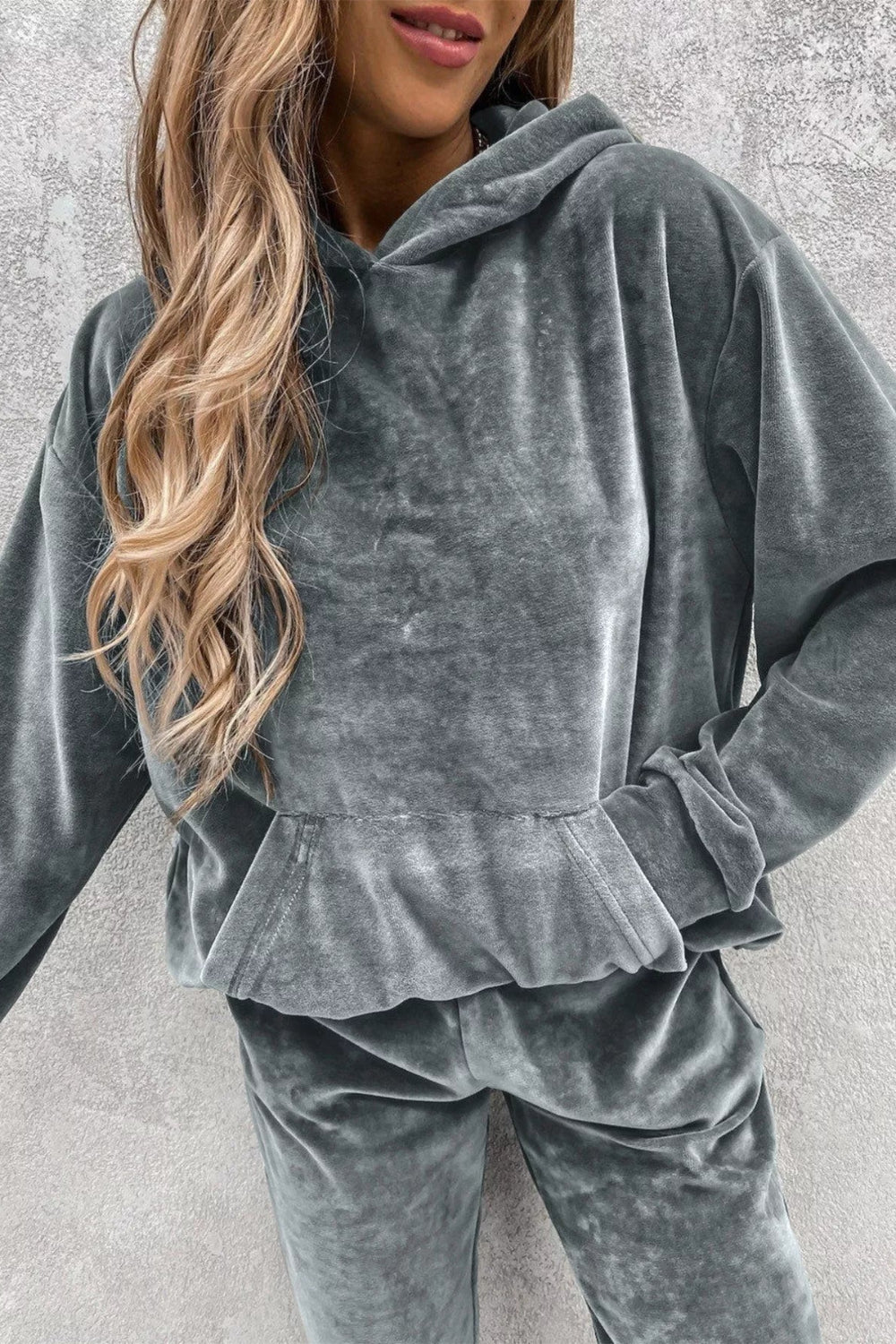 Two-piece jogger set, kangaroo pocket, drop shoulder, long sleeve, pocketed, soft fabric, no drawstrings, elastic waist, slightly stretchy, close up view