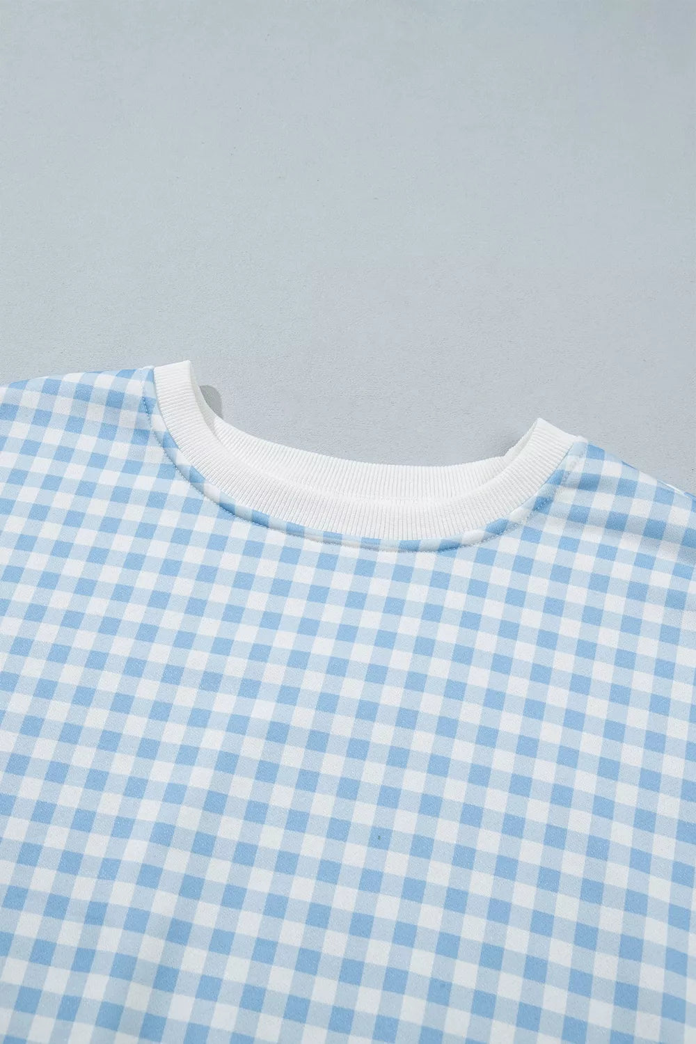 Since You Asked Short Set in light blue and white gingham with a long-sleeve top, white ribbed trim, and matching shorts.