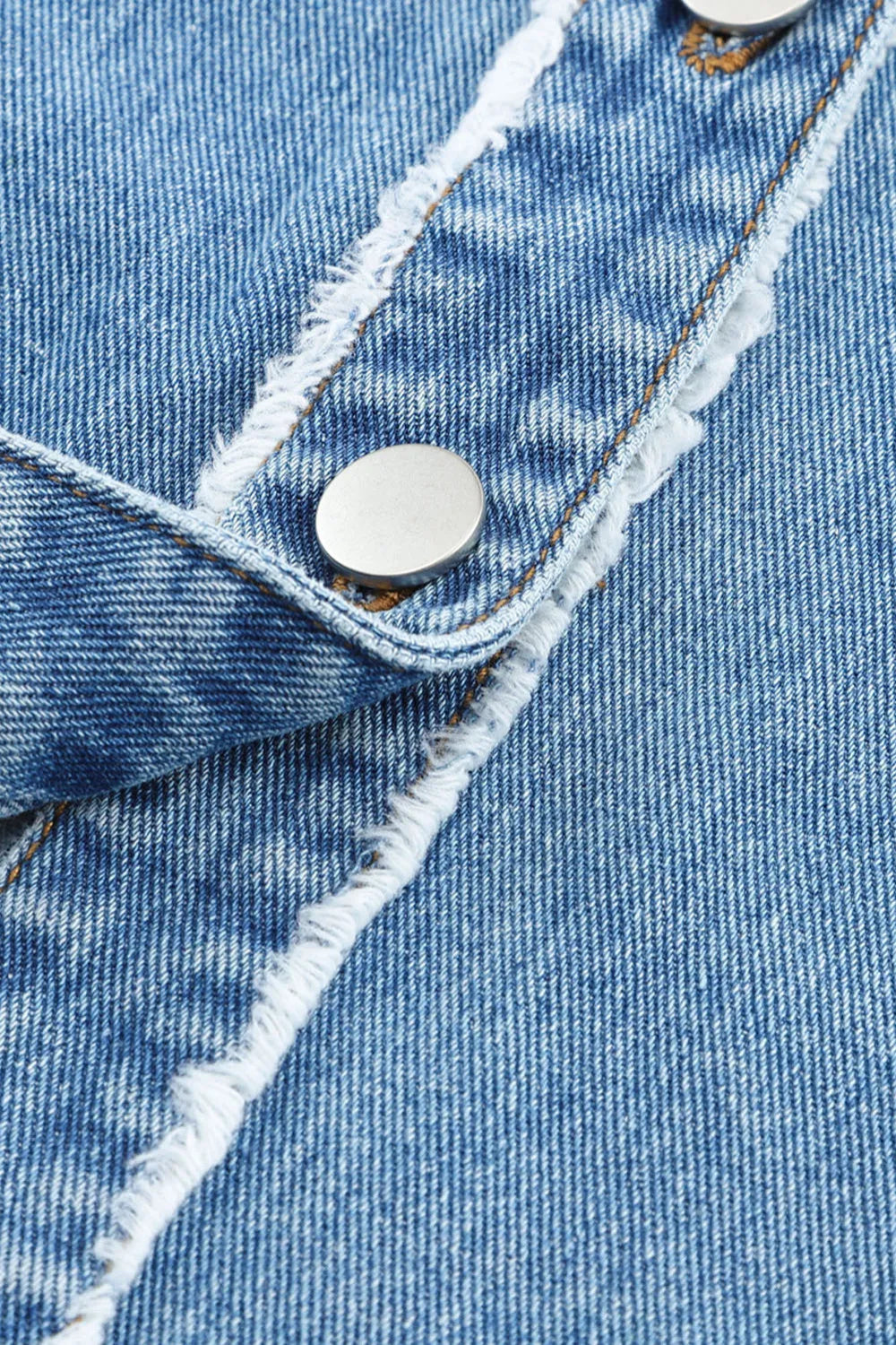 Denim jacket, colorblock, button down, raw hem, pockets, collared, no stretch, exposed seams close up 