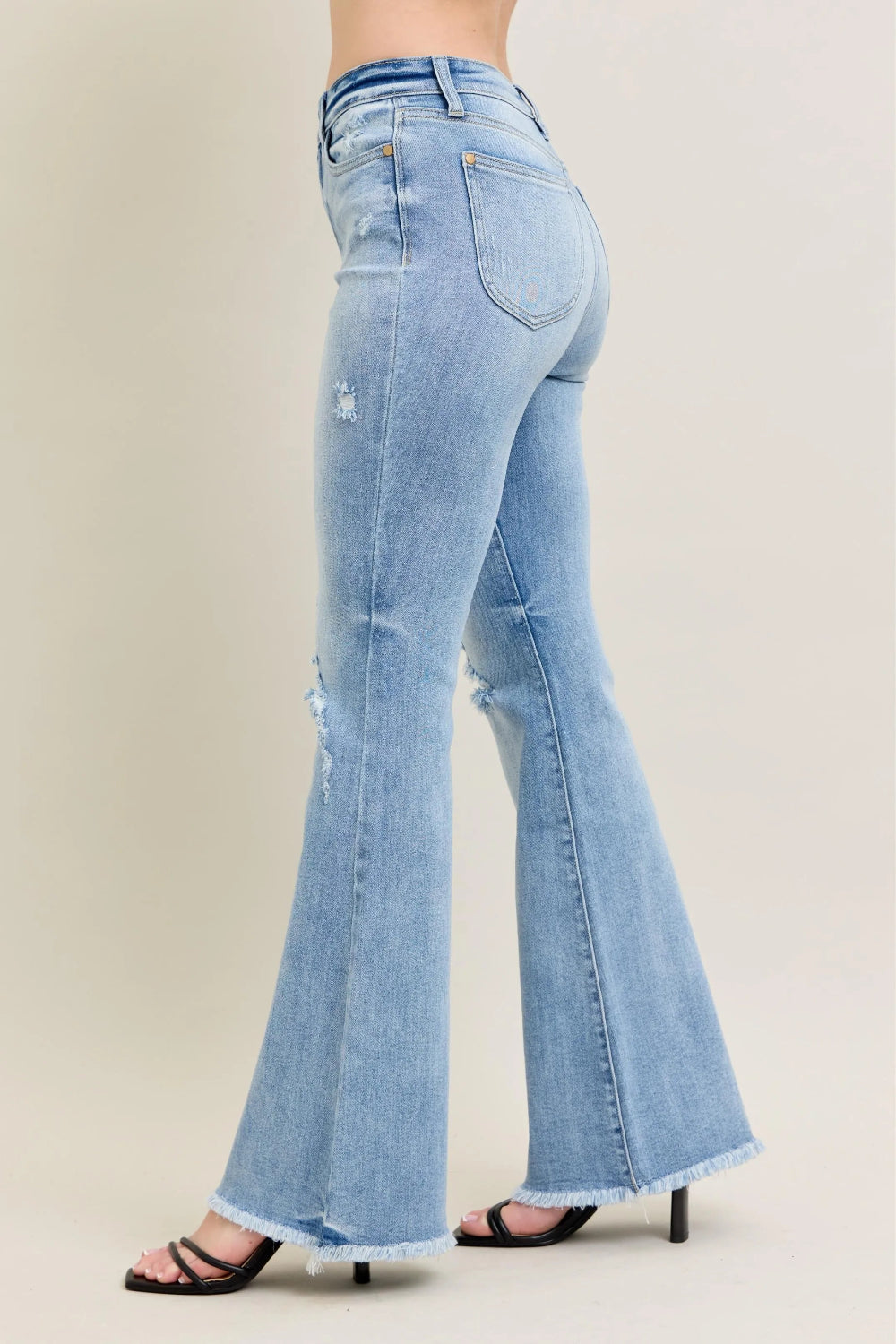 Judy Blue Jeans, full-size, high-rise, shield pocket, pocketed, flared, light wash, distressed knee, raw hem, stretchy, side view