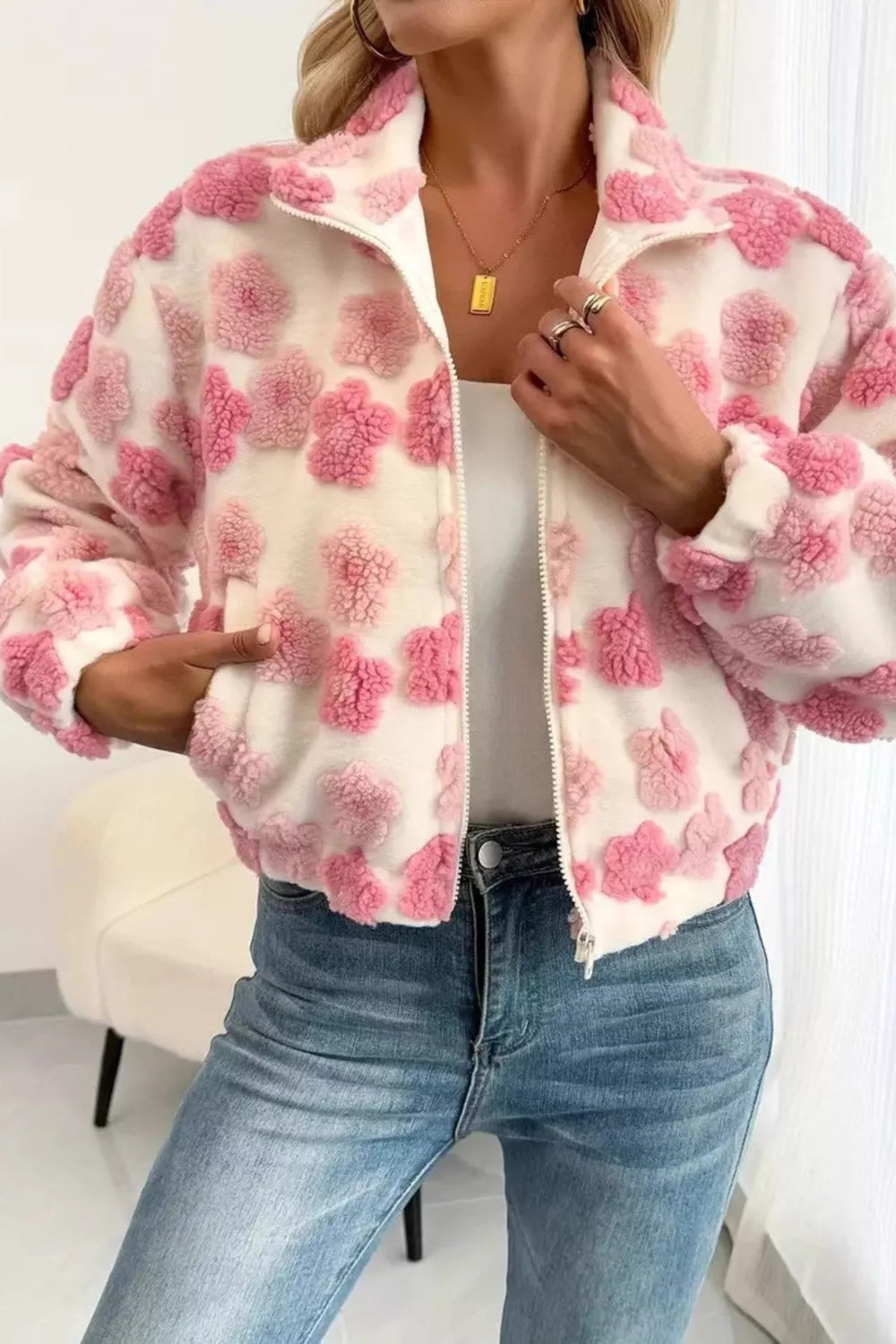 Jacket, unlined, collared, zippered, pocketed, puffy fleece flowers, oversized, sits at the waist, elastic waist and cuffs, no stretch, front view