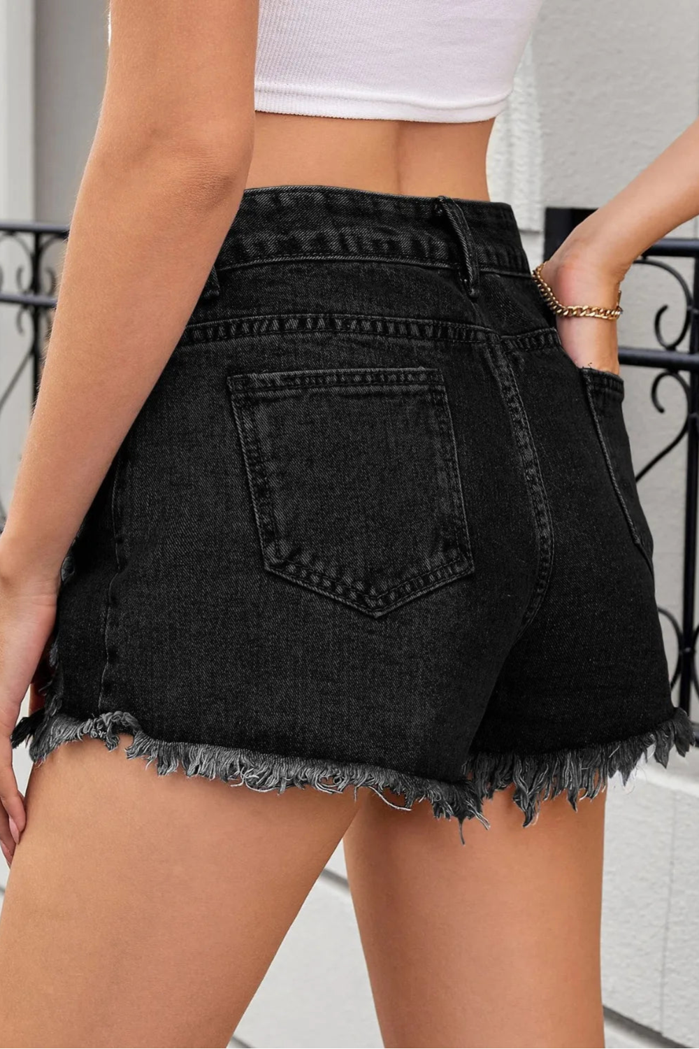 Distressed, Raw hem, High waist, Zipper and button closure, Functioning pockets,  No stretch, Denim shorts Side view