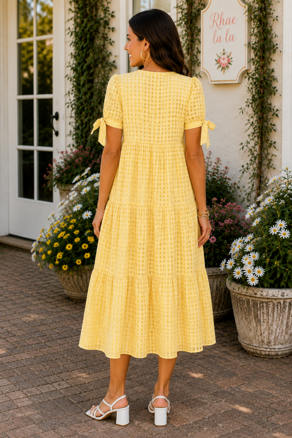 * Midi length
* Split v-neck
* Short sleeve
* Bow ties
* Tiered
* Gingham pattern
* Textured
* Unlined
* No stretch