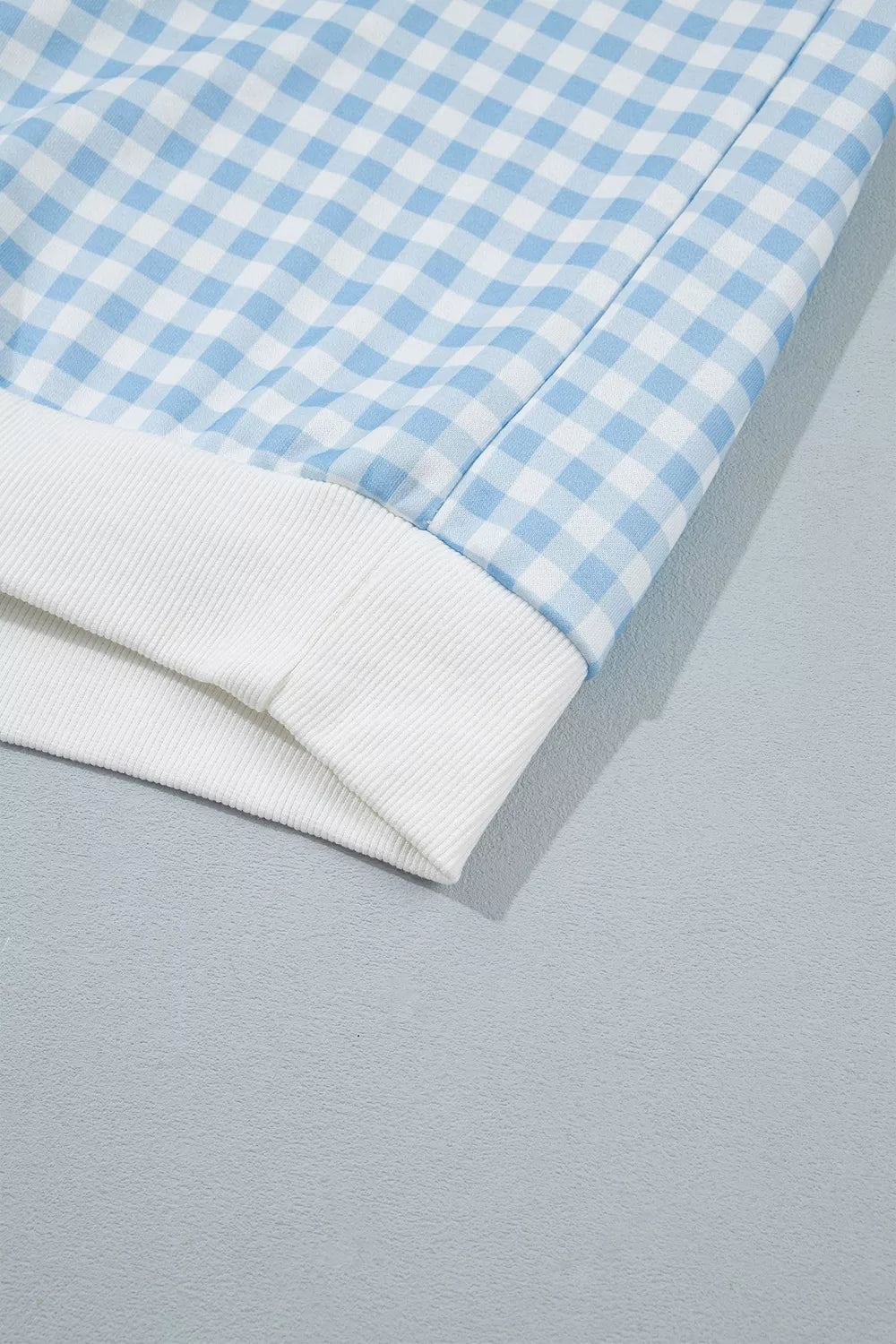 Since You Asked Short Set in light blue and white gingham with a long-sleeve top, white ribbed trim, and matching shorts.