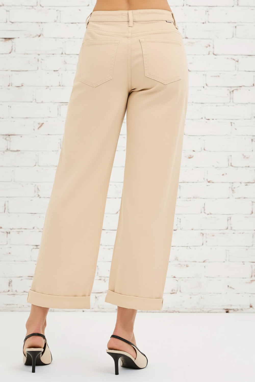 Risen, high-rise, tummy control, relaxed fit, wide leg, cuffed, pocketed, belt loops, button/zipper closure, stretchy, back view