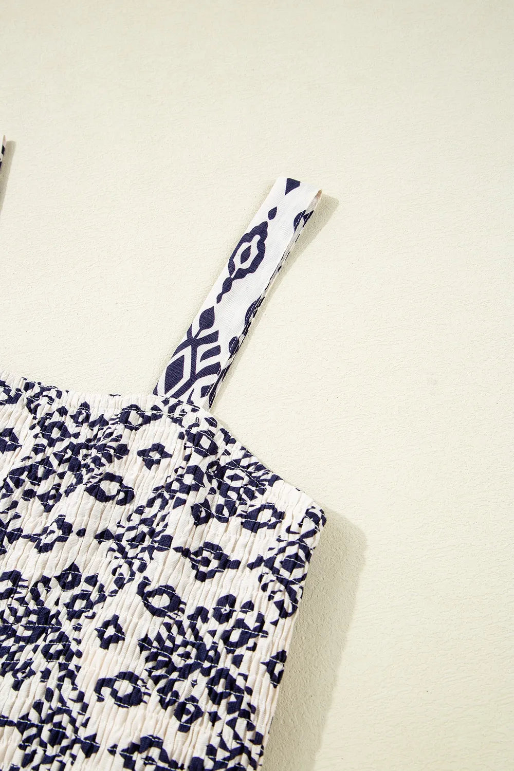 Jumpsuit, square neck, wide straps, smocked, wide leg, pleated, geometric print, no stretch close up view
