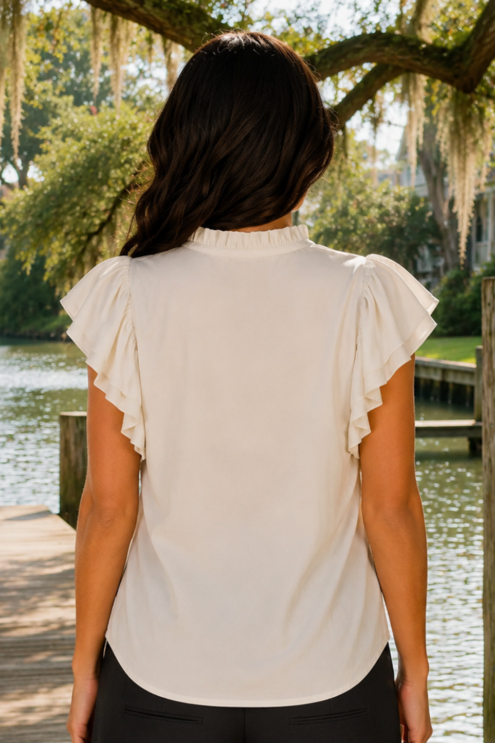 * Ruffle neck
* Ruffle sleeve
* Buttoned
* Tied
* Medium length
* Cream color
* Round hem
* No stretch