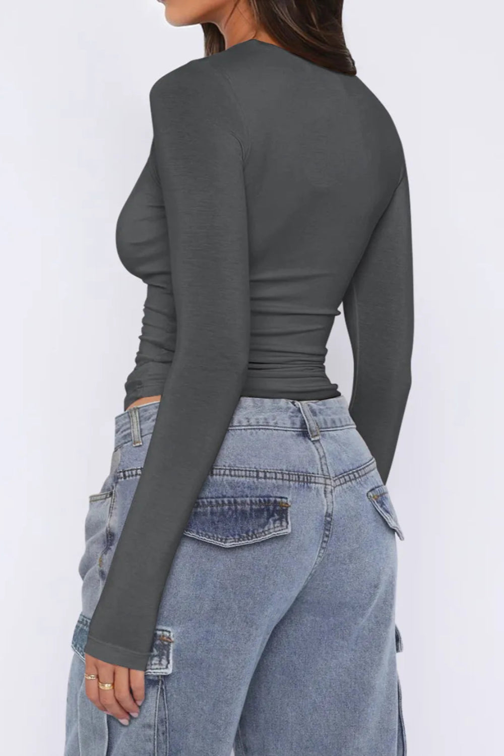 Top, asymmetrical neck, long sleeve, ruched, opaque, slightly stretchy, fitted, side view