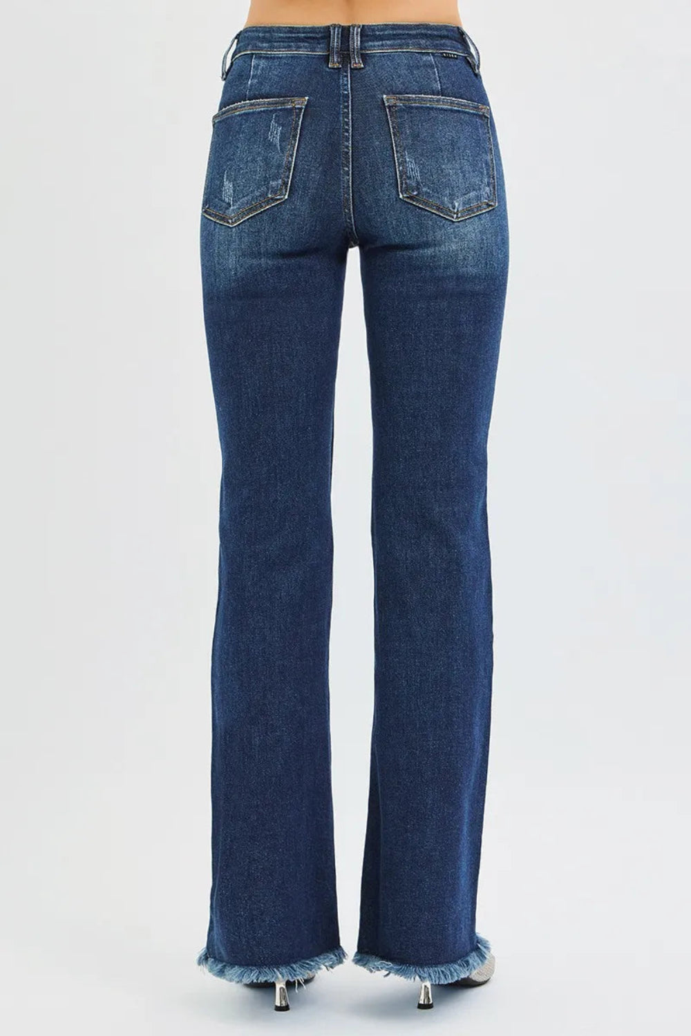 Risen jeans, full-size, high-rise, tummy control, flare, raw hem, distressed, 5-pocket detail, button-zipper closure, belt loop detail, dark vintage wash, slightly stretchy, back view