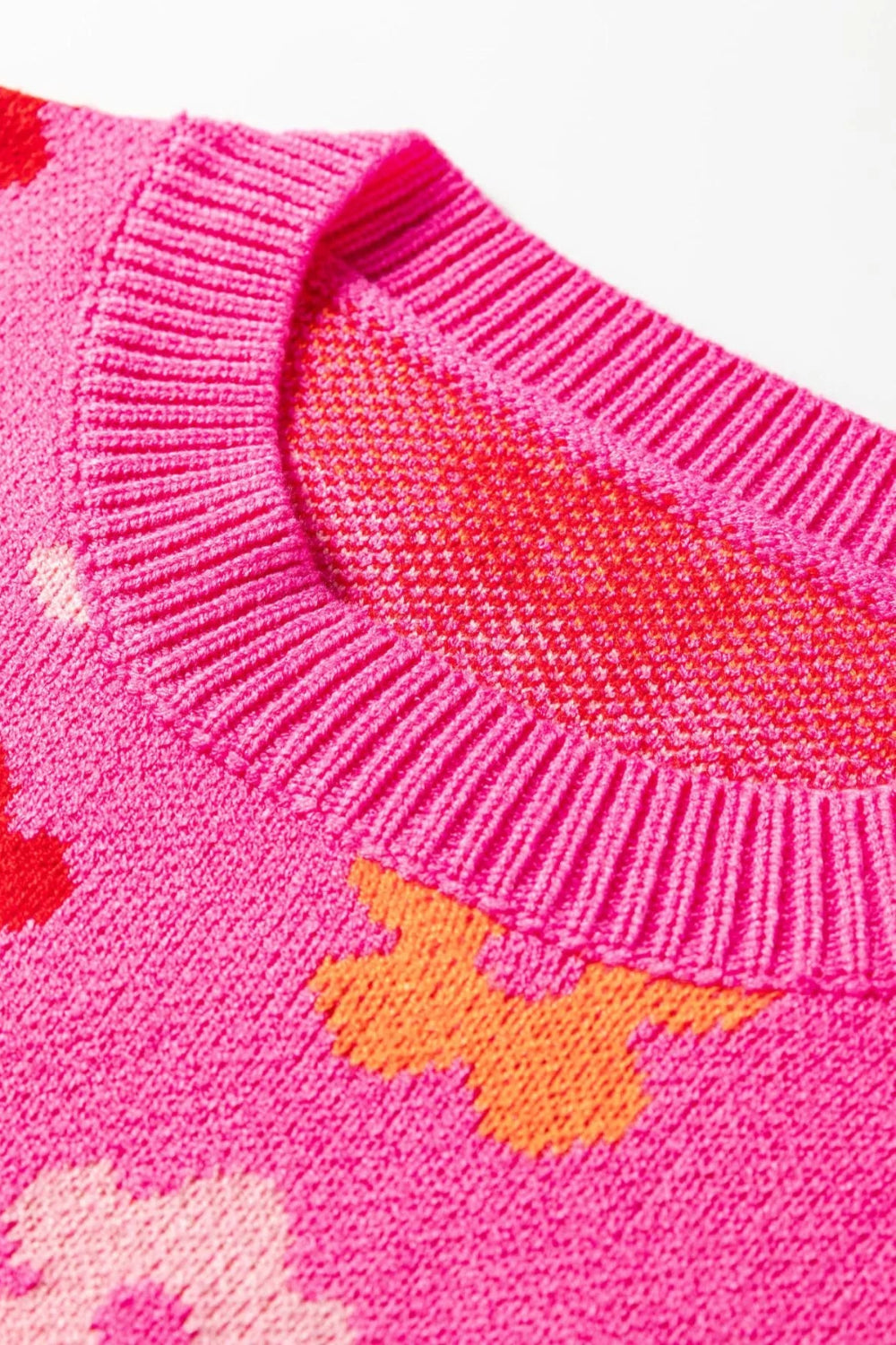 sweater, pullover, long sleeve, drop shoulder, round neck, flower print, ribbed trim, medium length, slightly stretchy, close up view