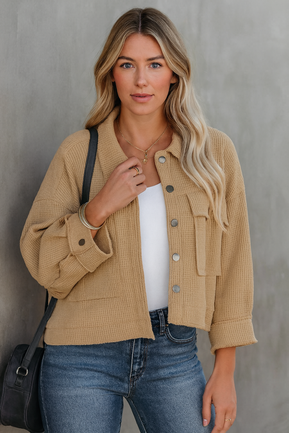 Jacket, collared, oversized, distressed, pleated, drop shoulder, buttoned, pocketed, long sleeve, waffle-knit, exposed seam, sits at the waist, pleated, adjustable straps, some stretch front view