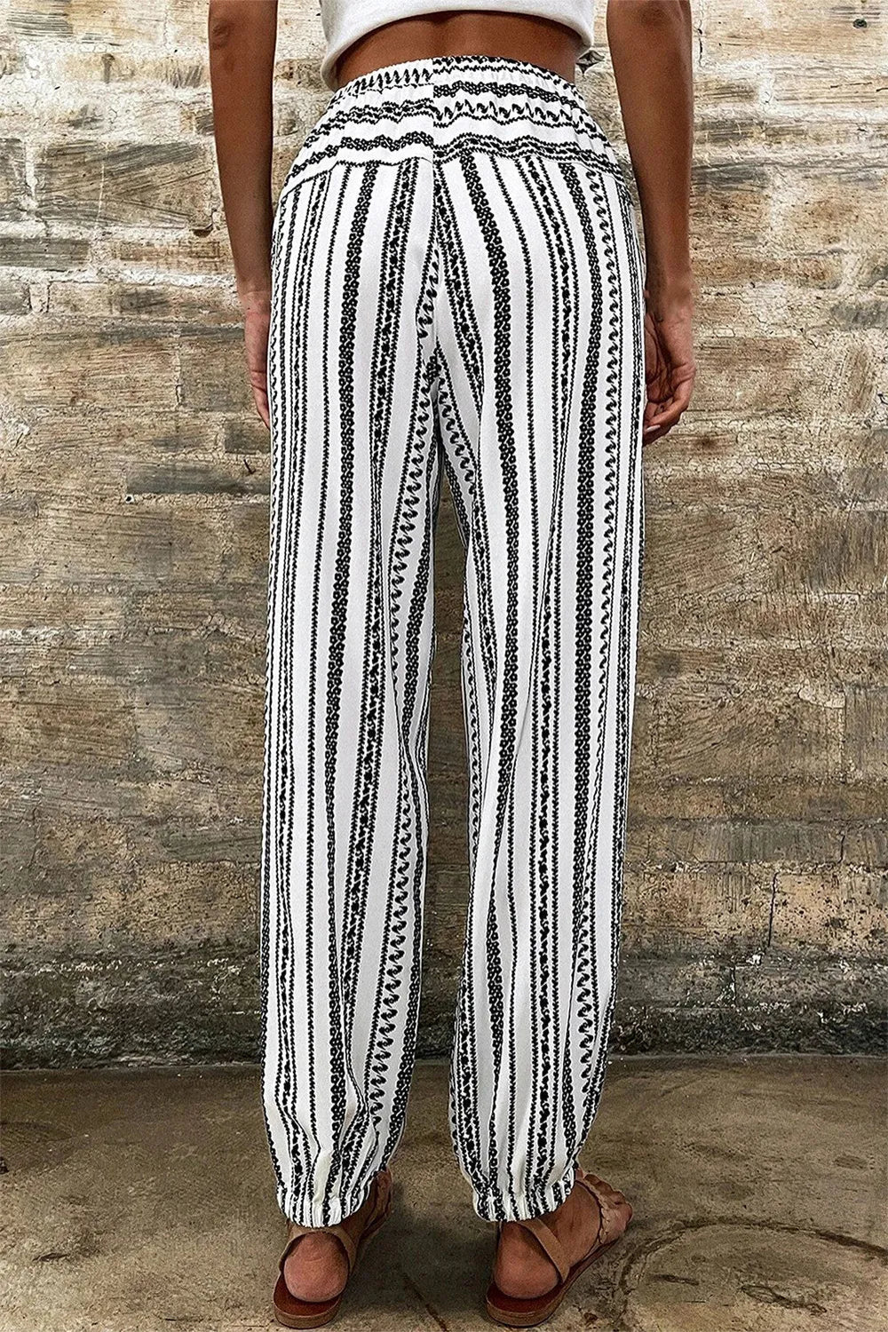 Joggers, high elastic drawstring waist, pocketed, elastic hem, opaque, geometric stripes, no elasticity back view