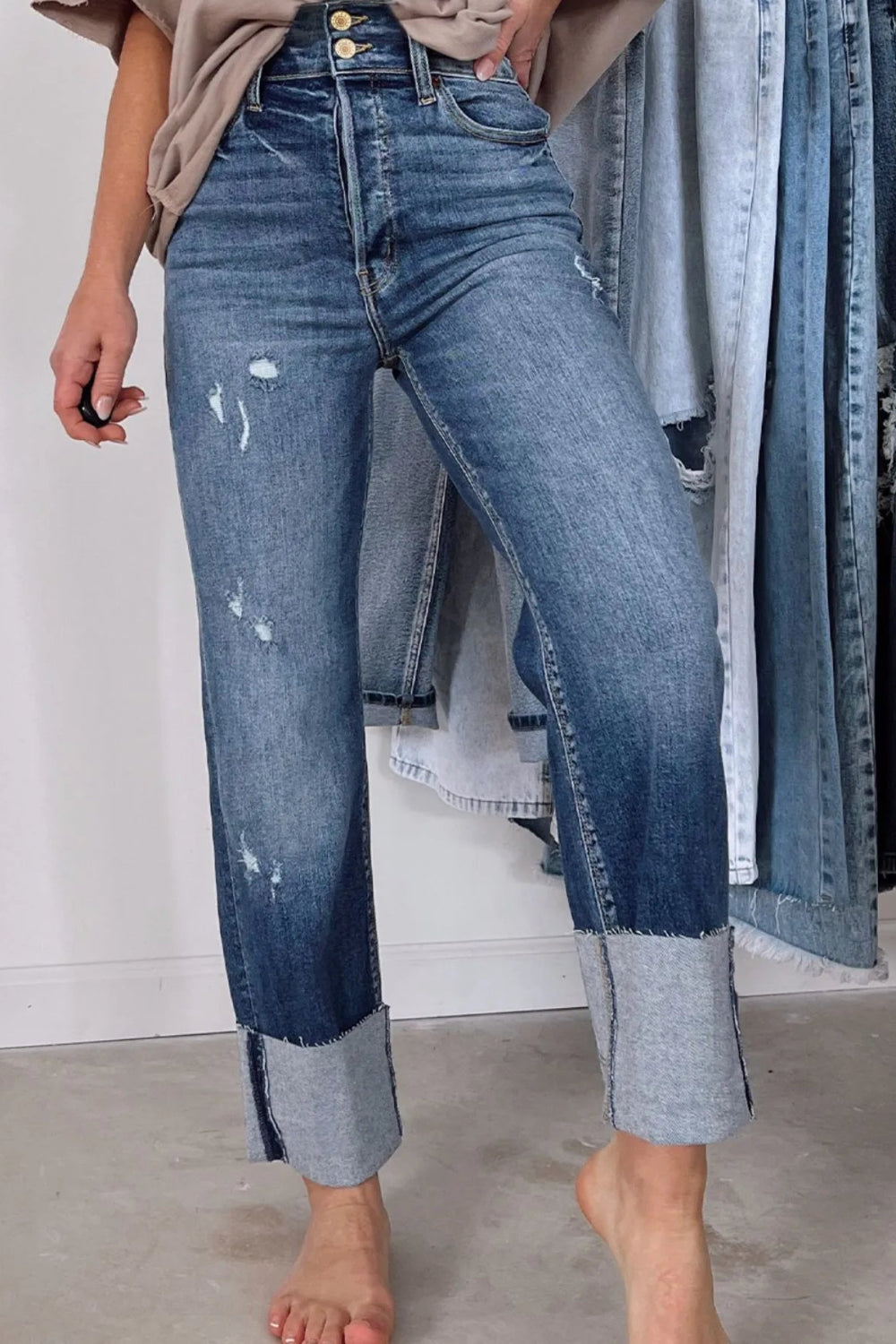 Jeans, straight leg, high-rise, distressed, pocketed, belt loops, raw hem, double button/zipper closure, slightly stretchy, front view