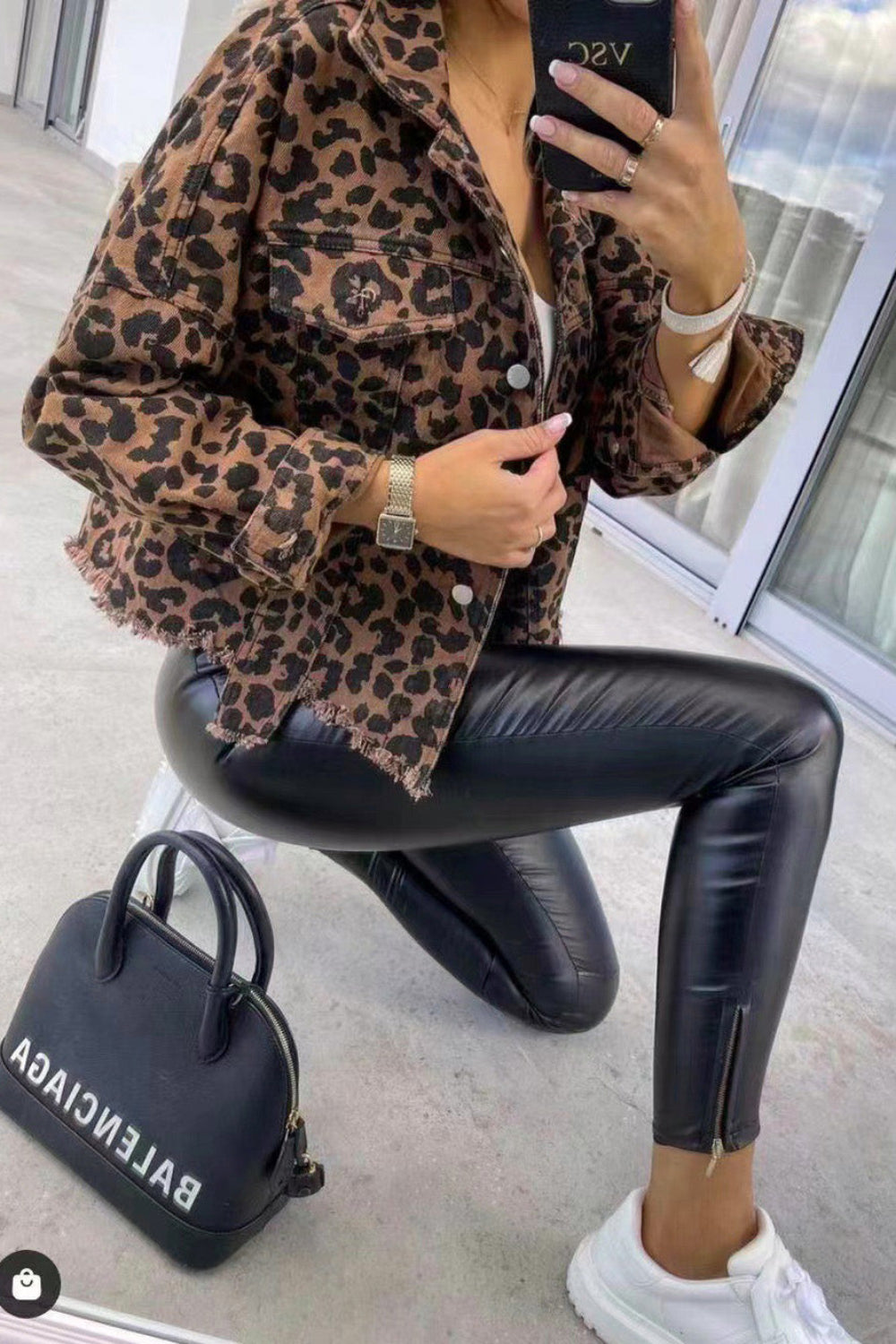 denim jacket, long sleeve, collared, drop shoulder, buttoned, pocketed, leopard print, distressed, no stretch, side view