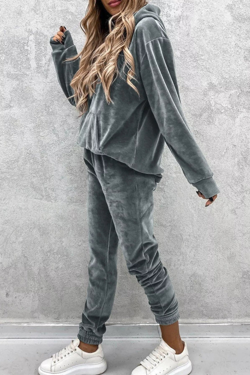 Two-piece jogger set, kangaroo pocket, drop shoulder, long sleeve, pocketed, soft fabric, no drawstrings, elastic waist, slightly stretchy, side view