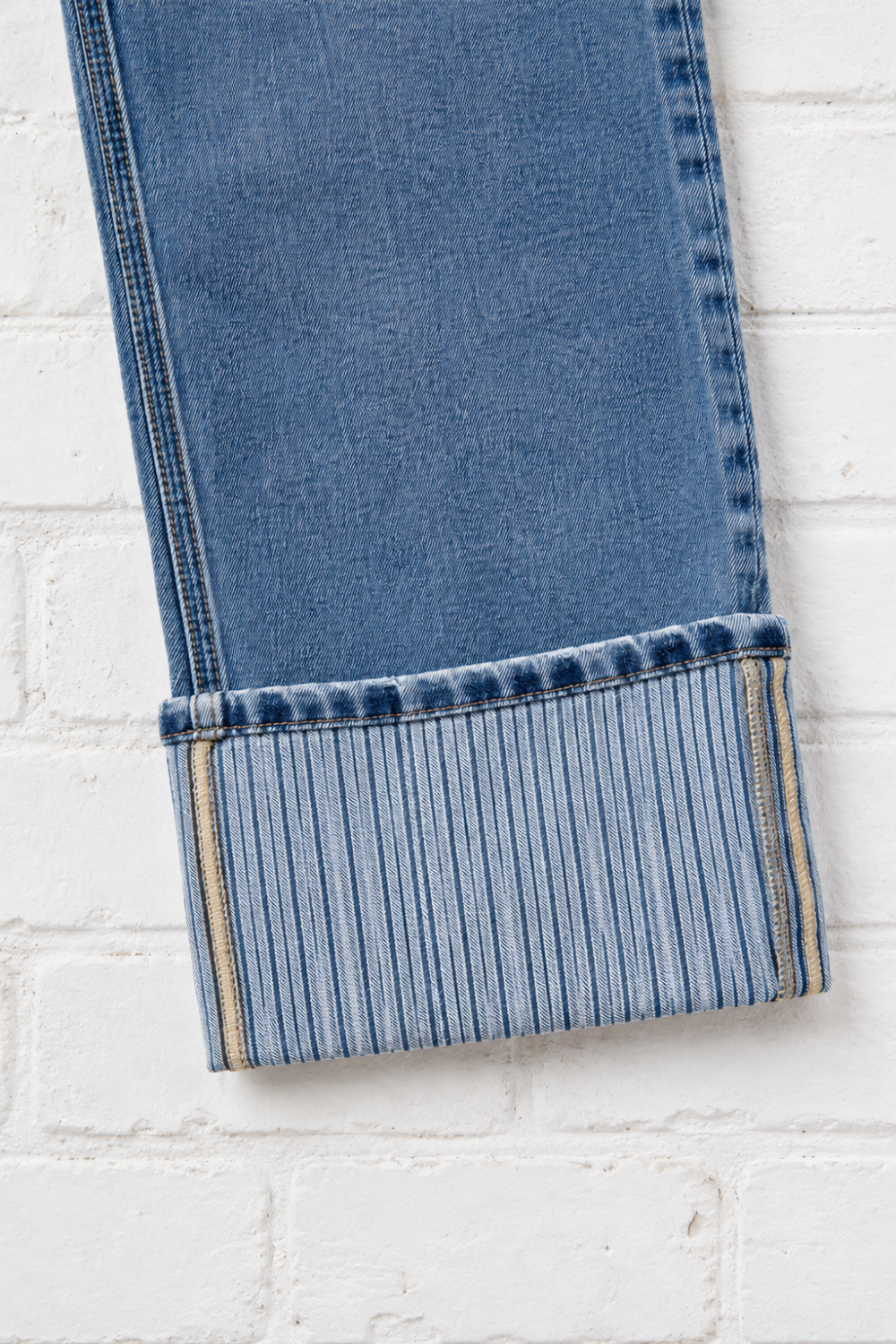 * Light wash
* Straight leg
* High-rise
* Cuffed
* Stripe detailing
* Loose fit
* Button/zipper closure
* Pocketed
* Belt loops
* Slightly stretchy