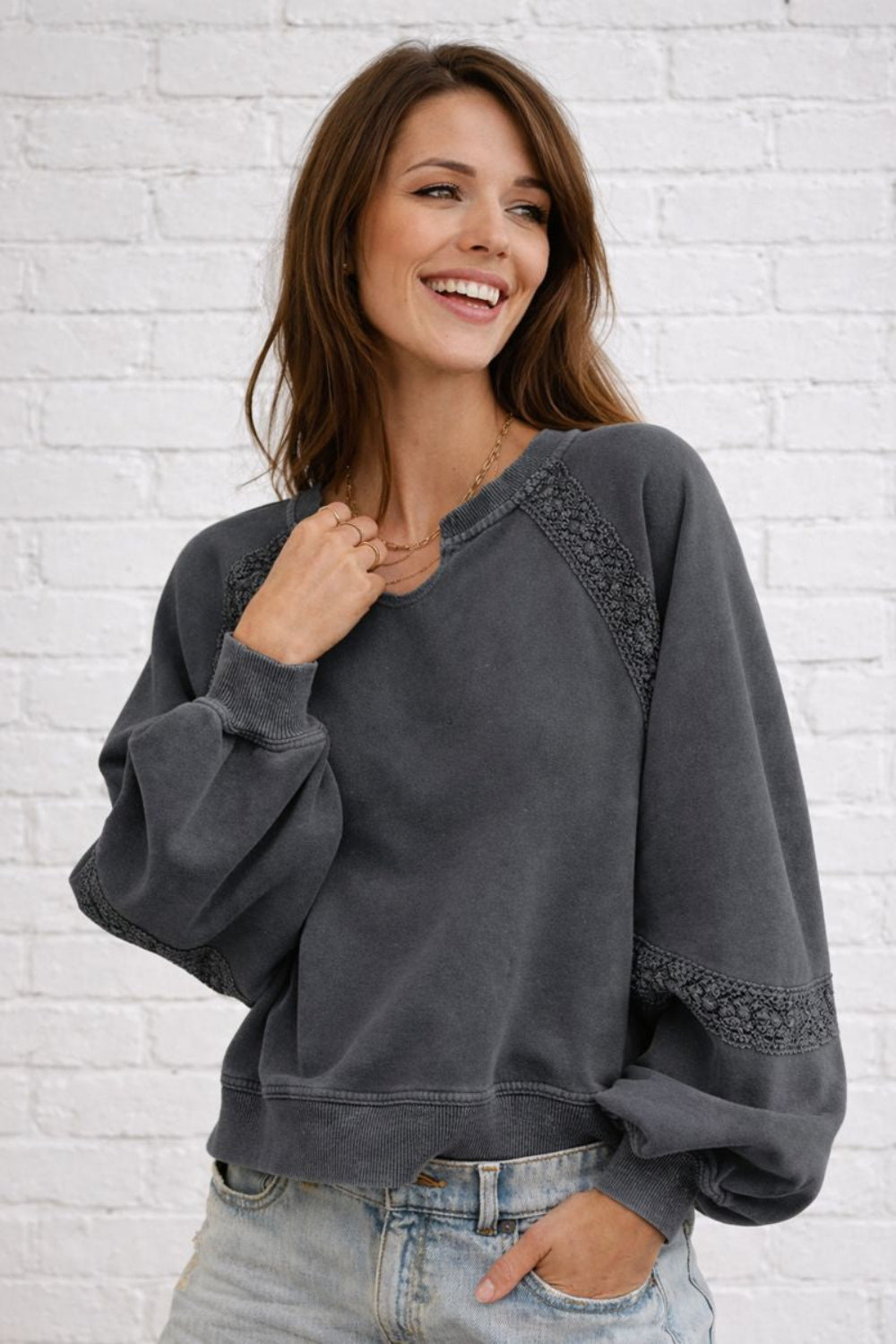 sweatshirt, washed, pullover, long sleeve, notched neck, raglan style, lace detail, oversized, slightly stretchy, front view