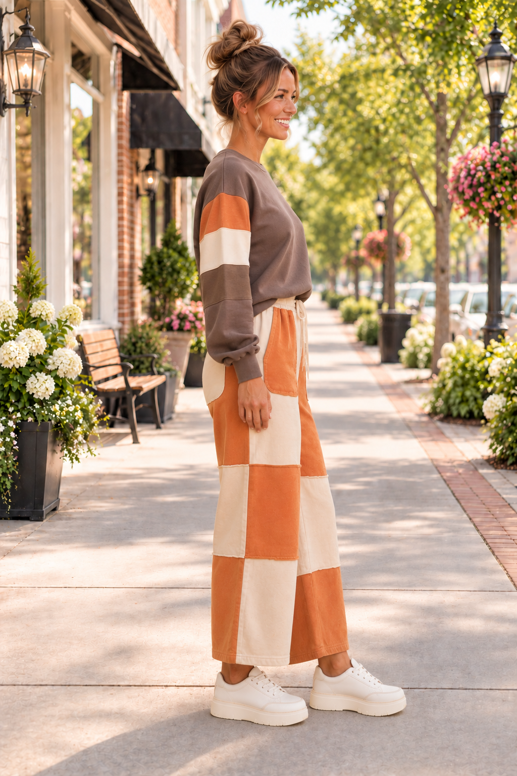 A woman wearing elastic high-waist, color block pants, with a drawstring, raw-seams, wide-leg with pockets, ankle length and slightly stretchy front view.