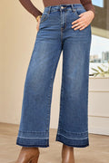 Jeans, high-rise, drop hem, raw hem, wide leg, pocketed, belt loops, button/zipper closure, vintage wash, some stretch, front view
