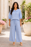  Two-piece pant set
* Gingham print
* Peter Pan collar
* Button down
* Half puff sleeves
* Elastic drawstring waist
* Pocketed
* Slightly stretchy