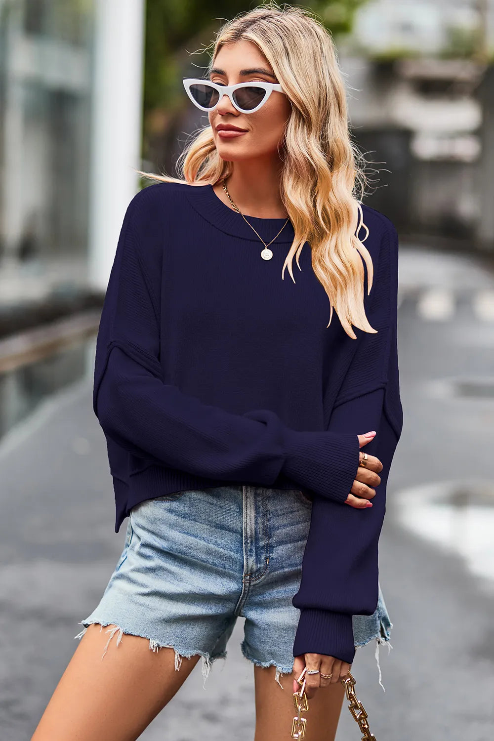 sweater, pullover, long sleeve, round neck, drop shoulder, exposed seams, batwing, ribbed, side slit, slightly stretchy, front view