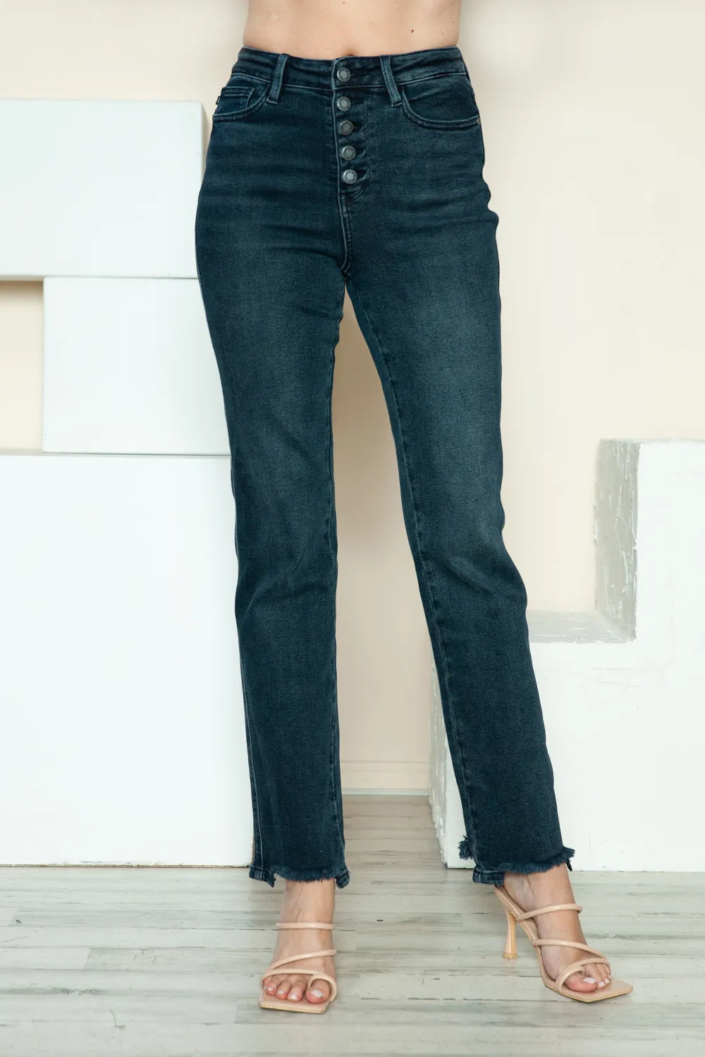 Judy Blue Button Fly Straight Leg Jeans feature a dark wash, raw hem, stretch fit, and classic pockets front view