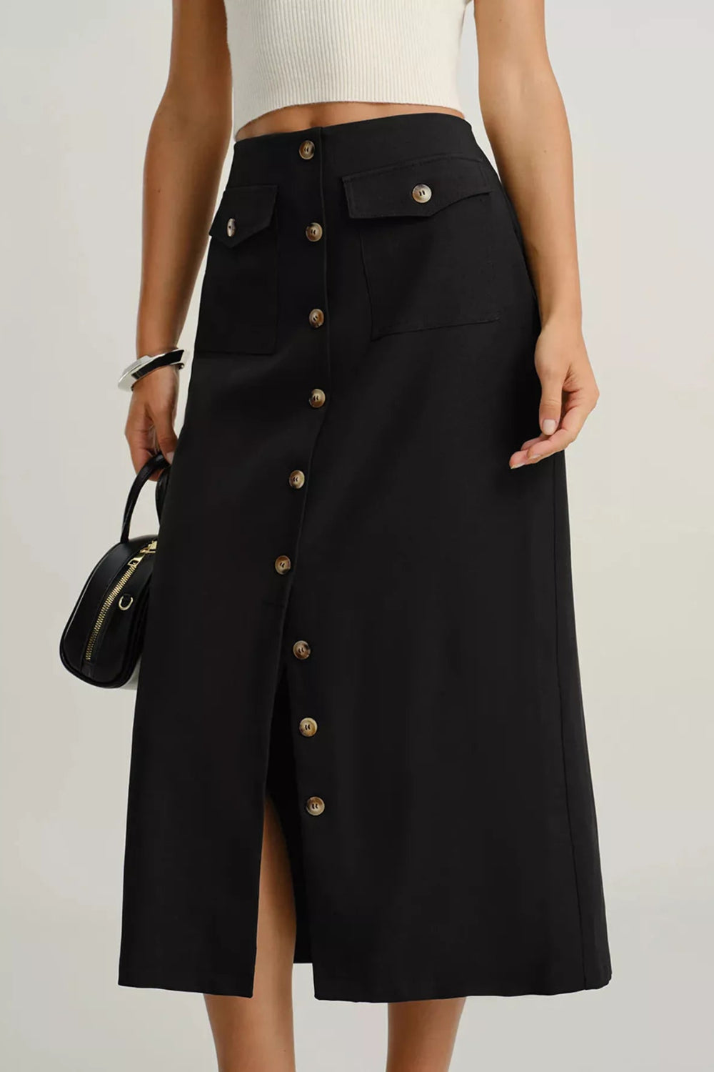 Midi-skirt, buttoned, front patch pockets, back zipper, unlined, some stretch, front view
