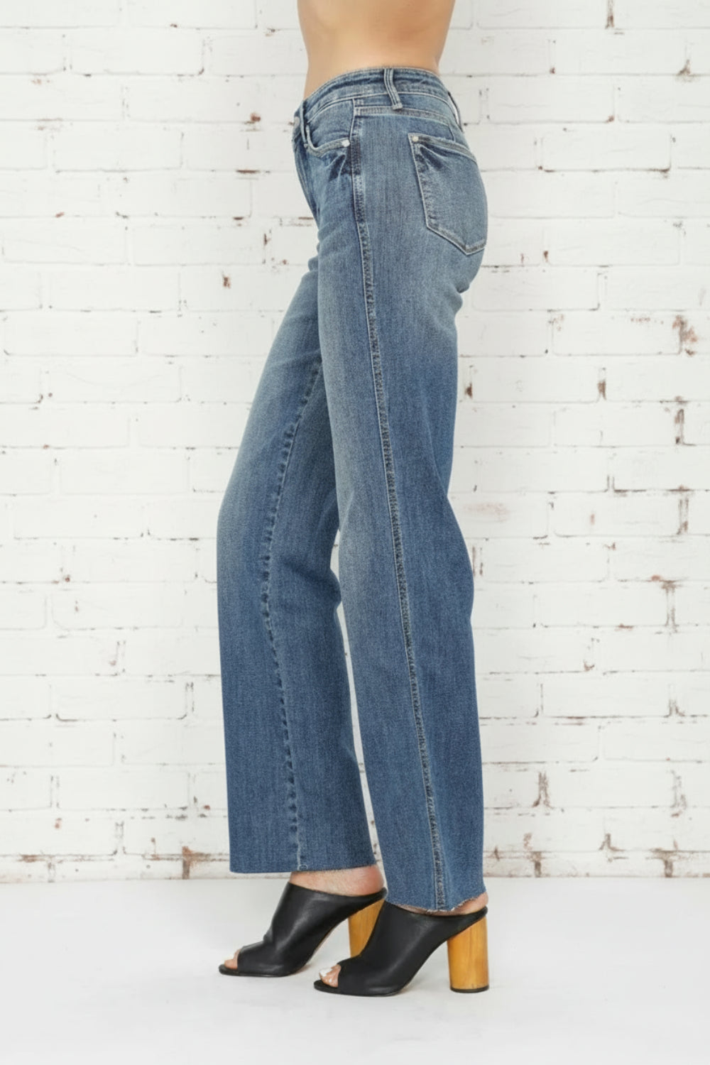 Judy Blue Jeans, full-size, tummy control, straight leg, pocketed, belt loops, button/zipper closure, light vintage wash, raw hem, stretchy, side view