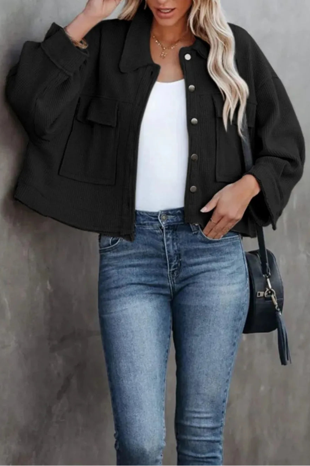 Jacket, collared, oversized, distressed, pleated, drop shoulder, buttoned, pocketed, long sleeve, waffle-knit, sits at the waist, pleated, adjustable straps, some stretch front view