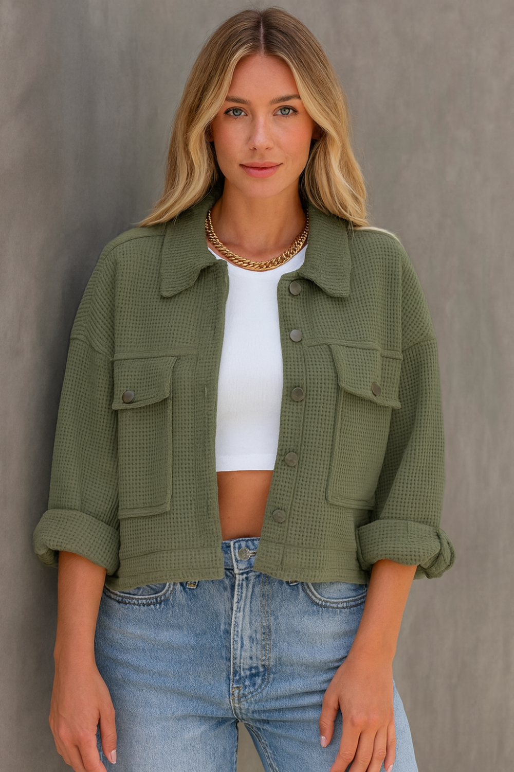 Jacket, collared, oversized, distressed, pleated, drop shoulder, buttoned, pocketed, long sleeve, waffle-knit, exposed seam, sits at the waist, pleated, adjustable straps, some stretch front view