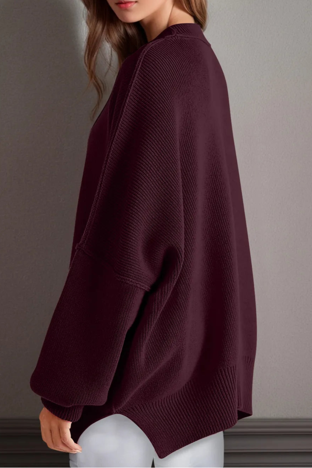 Sweater, oversized, drop shoulder, round neck, exposed seam, long, side slit, ribbed, stretchy side view
