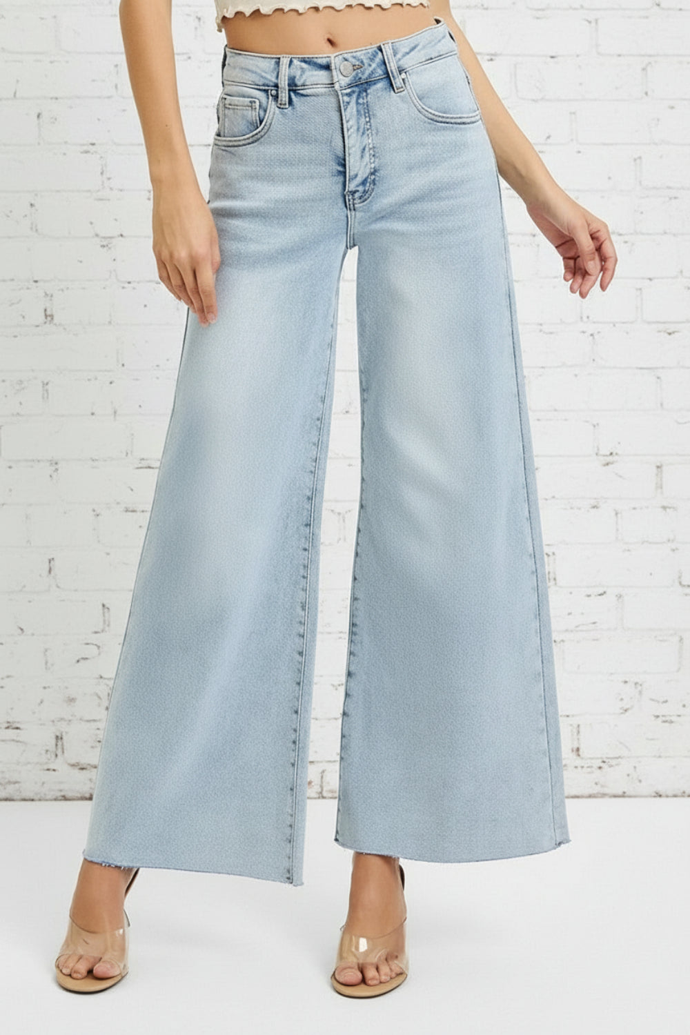 Risen Jeans, full-size, high-rise, wide leg, palazzo style, light wash, raw hem, button/zipper closure, belt loops, pocketed, slightly stretchy, front view
