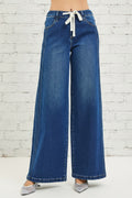 Risen Jeans, full-size, mid-rise, side pin tuck, wide leg, belt loops, elastic waist in back, drawstring closure, pocketed, dark wash, slightly stretchy, front view
