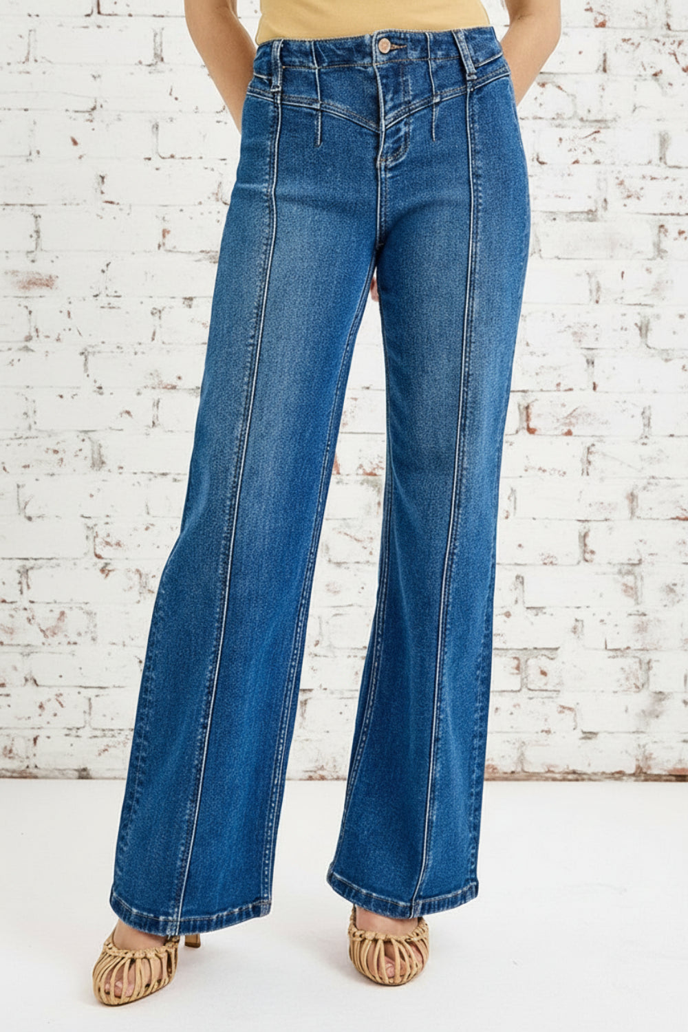 Risen jeans, high-rise, wide leg, dark wash, reinforced stitching, button-zipper closure, belt loop detail, slightly stretchy, front view