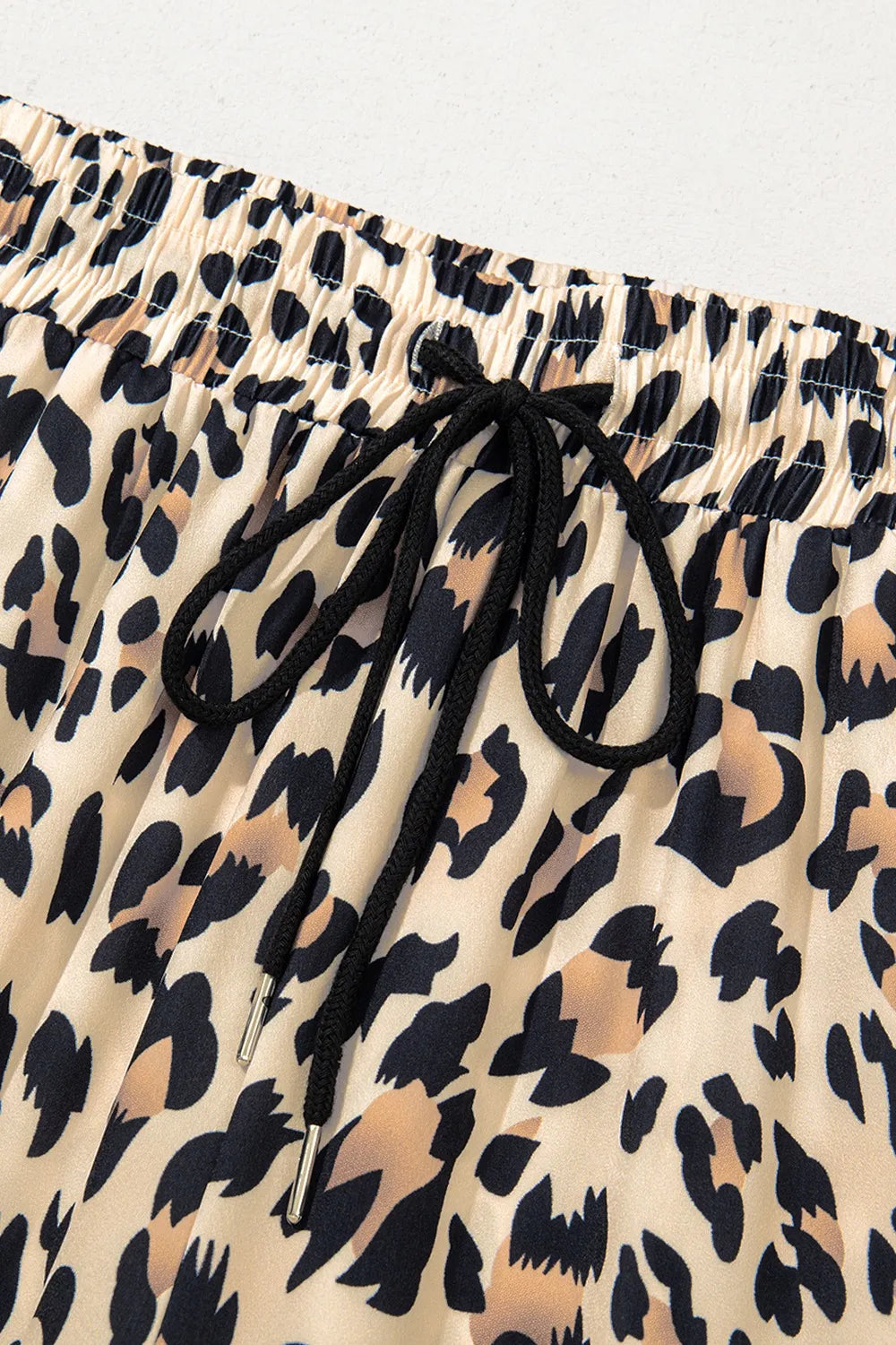 Pants, leopard print, high waist, elastic waistband, drawstring, pocketed, wide leg no stretch close up view