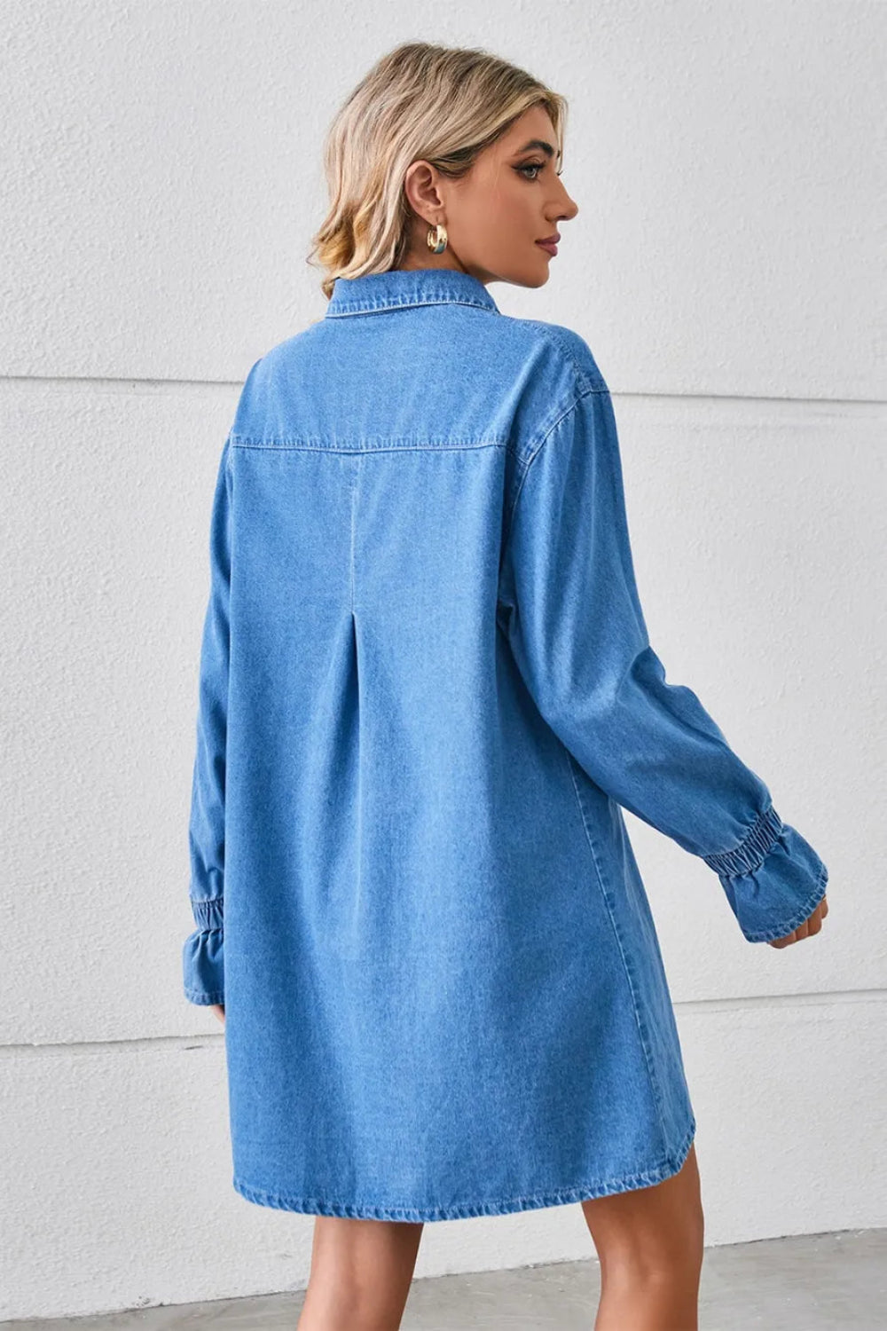 Shirt dress, mini, denim, drop shoulder, long sleeve, elastic ruffled cuffs, collared, front patch pockets, back pleat, no stretch, back view
